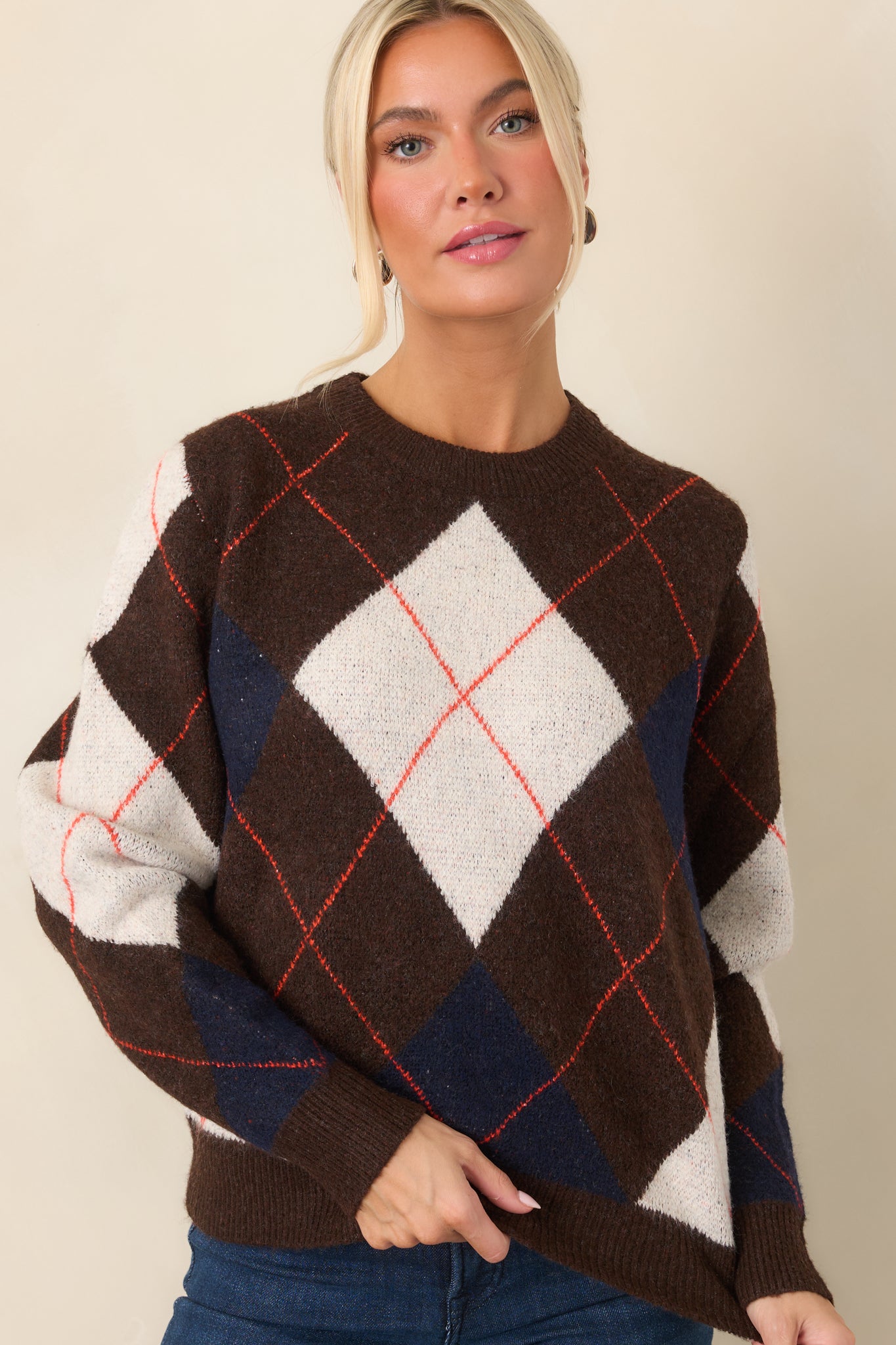 Ivory and navy diamond accents stand out against the brown knit base with fine rust-red striping.