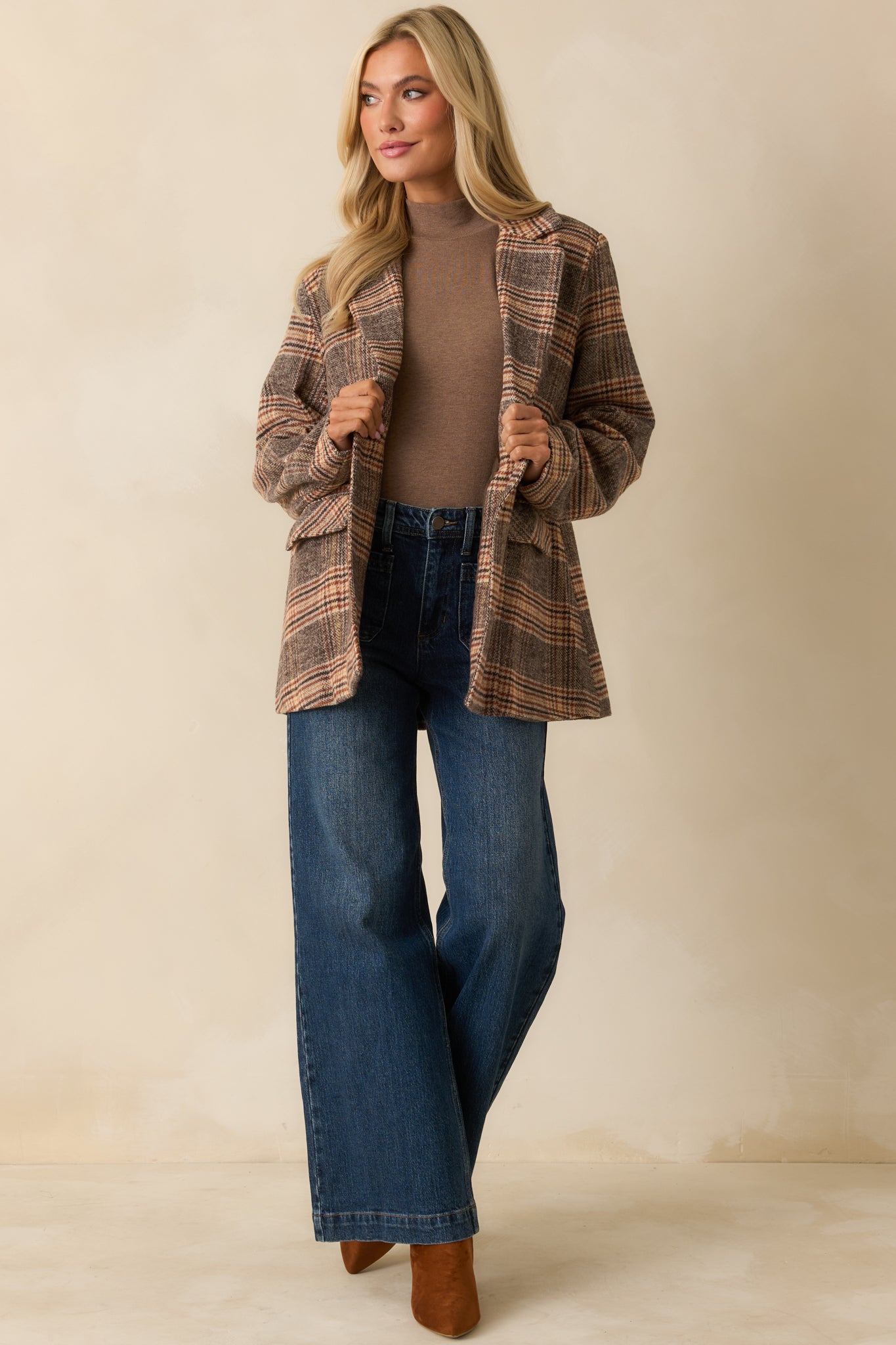 Relaxed fit brown plaid overcoat showing the full front view, highlighting its mid-length silhouette and structured collar.