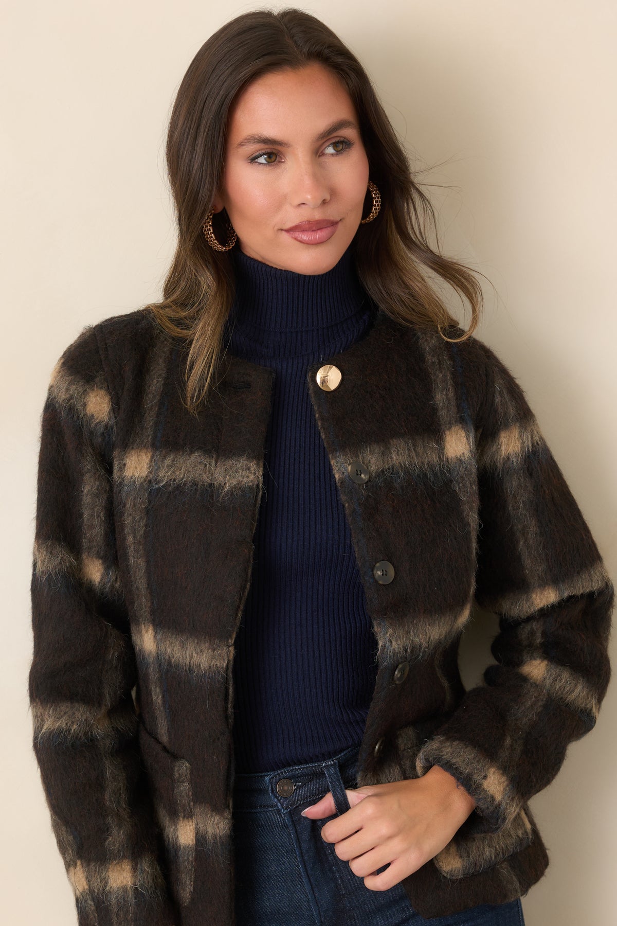 Rich brown plaid jacket with a gently shaped waist and concealed button-front closure.
