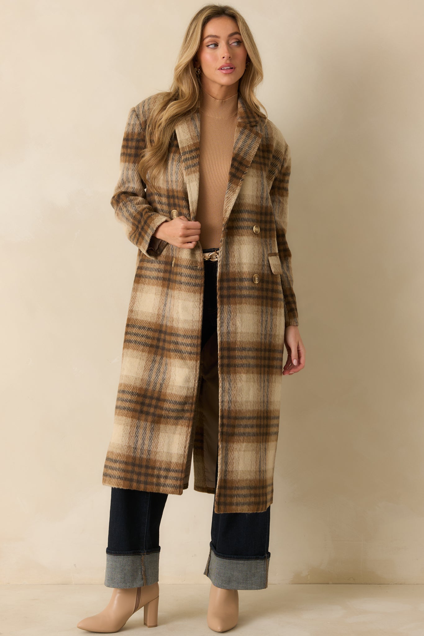 Brown plaid wool-blend overcoat styled open to showcase its longline silhouette and classic double-breasted front.