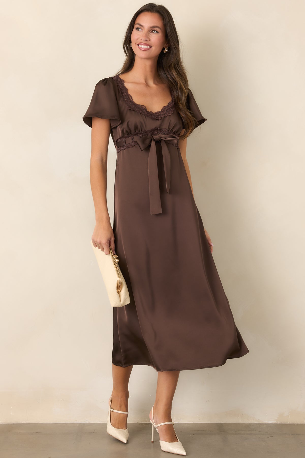 Brown satin dress with a gathered bodice and graceful softly flared midi hem.