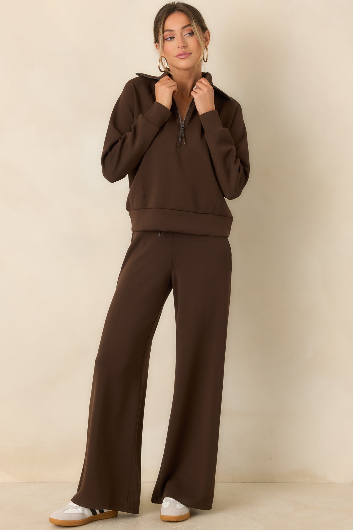 Lush brown spacer fabric pants with a relaxed fit, adjustable drawstring waistband, and fluid wide legs.