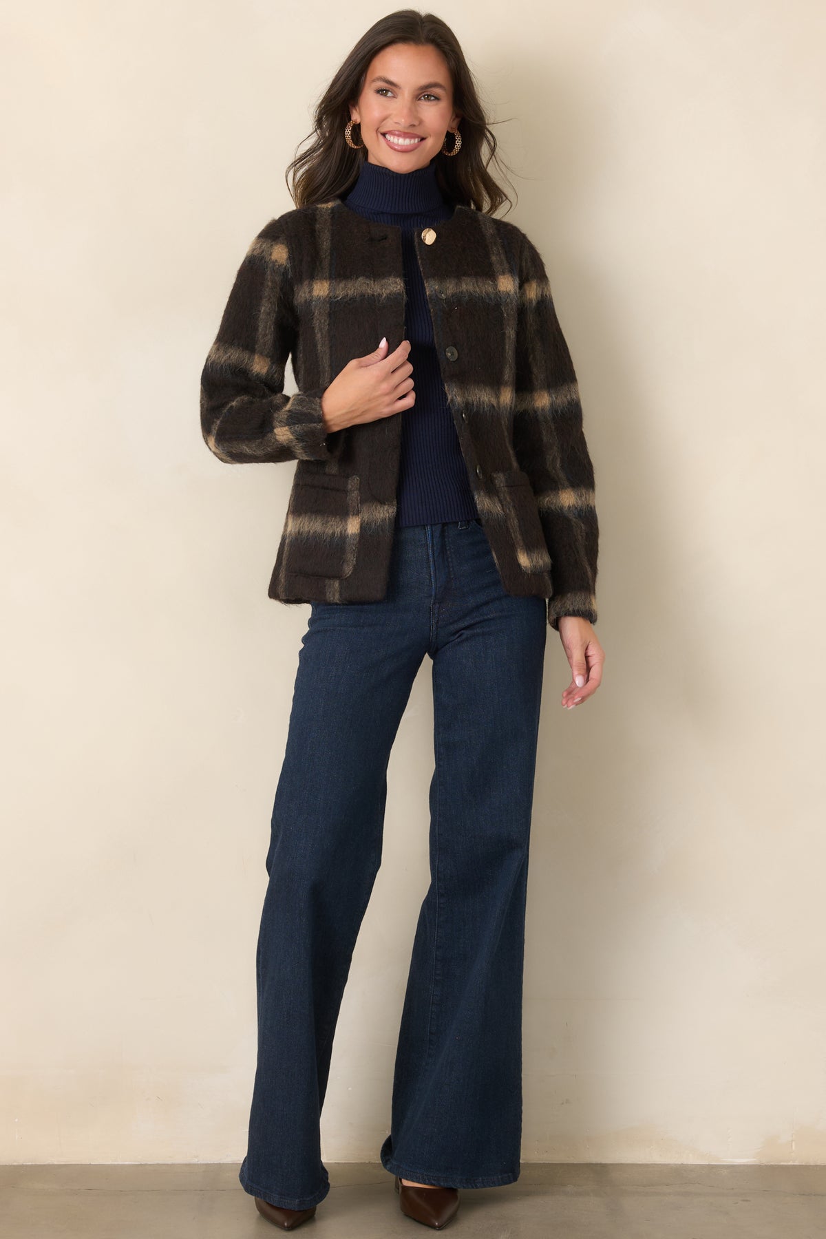 Refined wool-blend jacket with tan and subtle navy plaid, front patch pockets, and a collarless neckline.