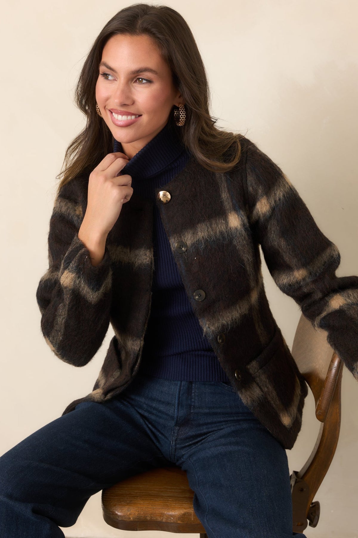 Brushed wool-blend jacket with a rich brown base, tan and navy plaid, and a collarless round neckline.