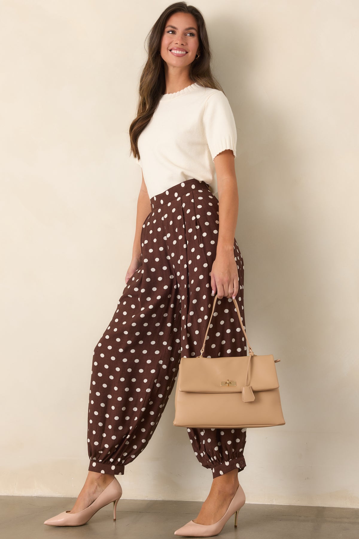 Textured viscose-blend pants with an allover ivory polka dot pattern and distinctive balloon-shaped silhouette.