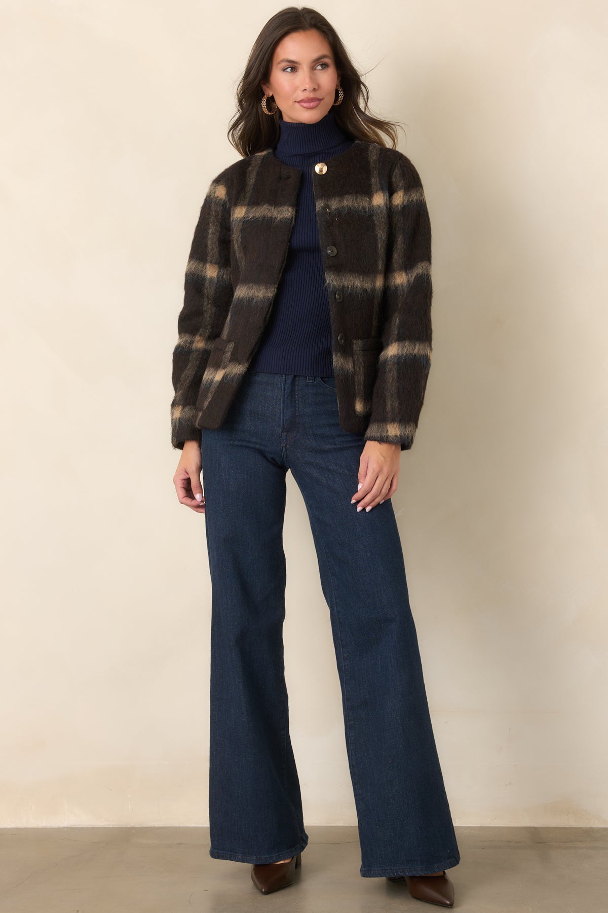 Brown wool-blend jacket showcasing the tan and navy plaid pattern and collarless round neckline.