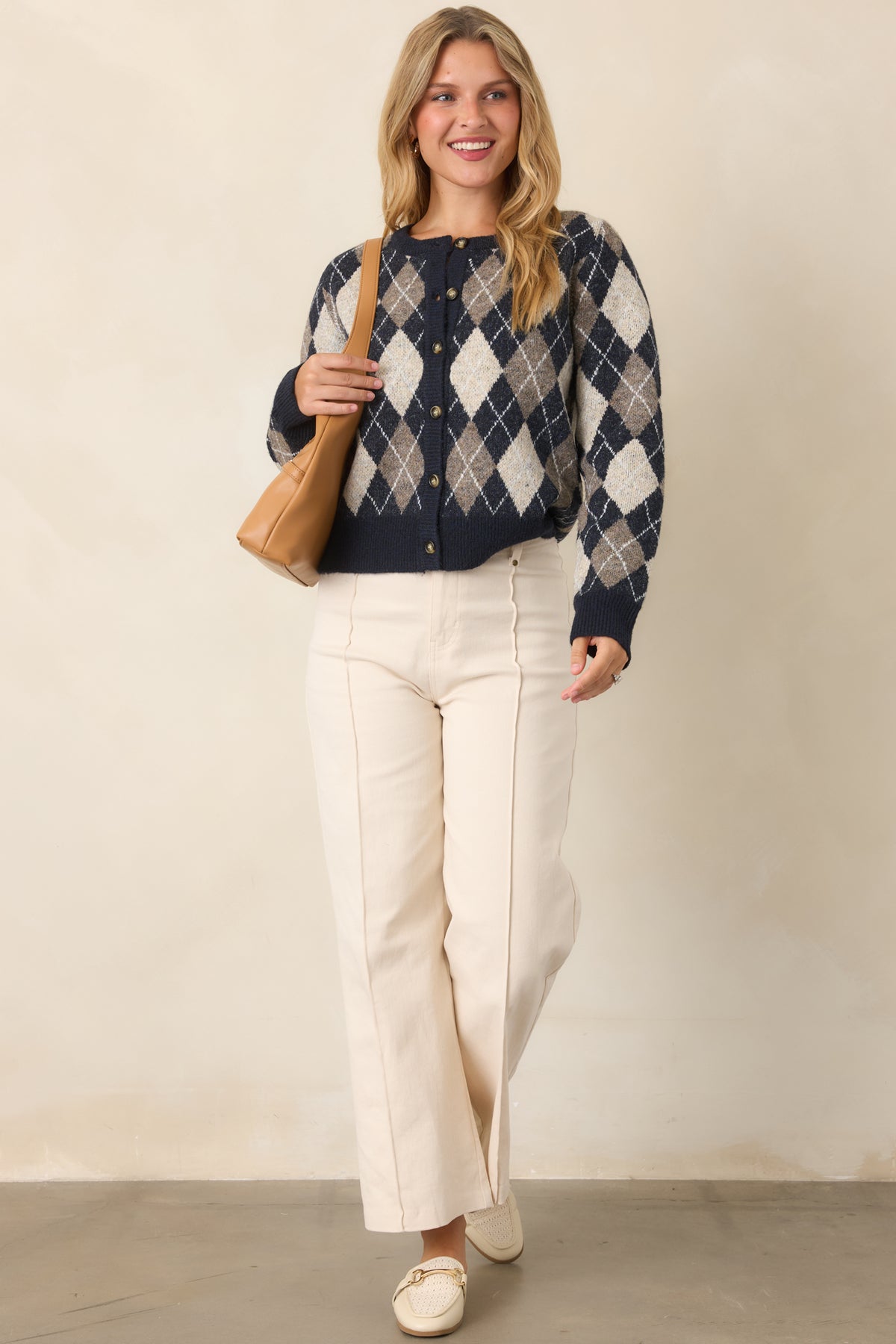 Softly brushed knit cardigan showcasing the navy, taupe, and ivory diamond pattern with a button-front closure.