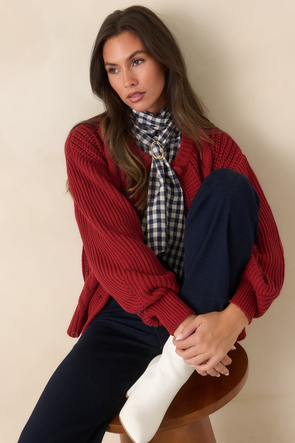 Burgundy cardigan featuring the relaxed dropped-shoulder construction and voluminous long sleeve.