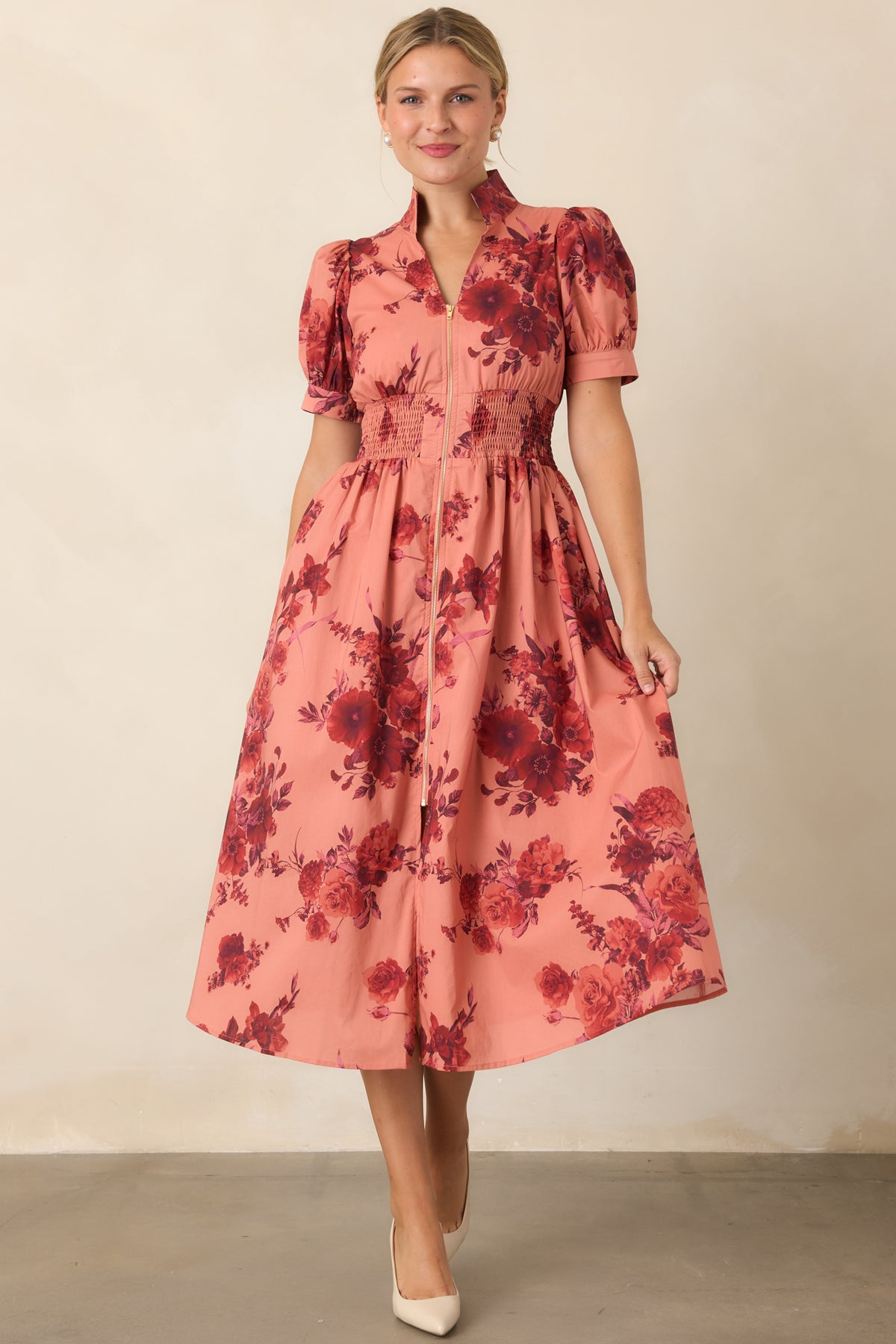 Burgundy floral cotton dress highlighting the defined smocked waist and gently flared A-line silhouette.