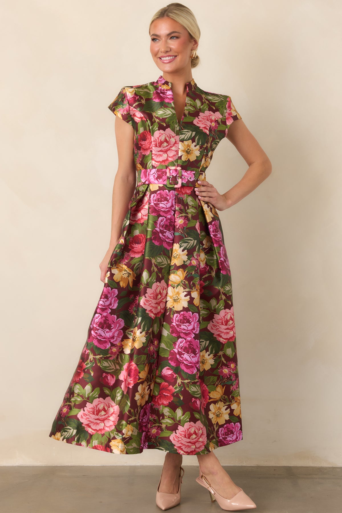 Burgundy floral dress showcasing the colorful botanical print, notched collar, softly structured sleeves, and voluminous A-line skirt.