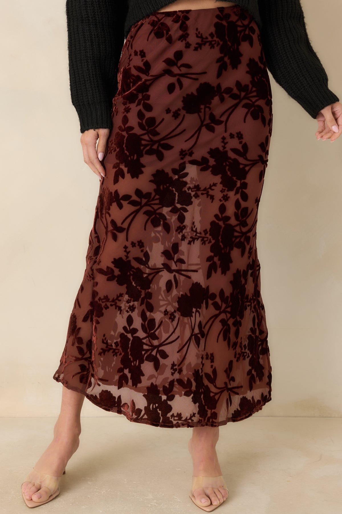 Burgundy floral velvet burnout pattern creates dimensional contrast against the skirt’s sheer mesh background.