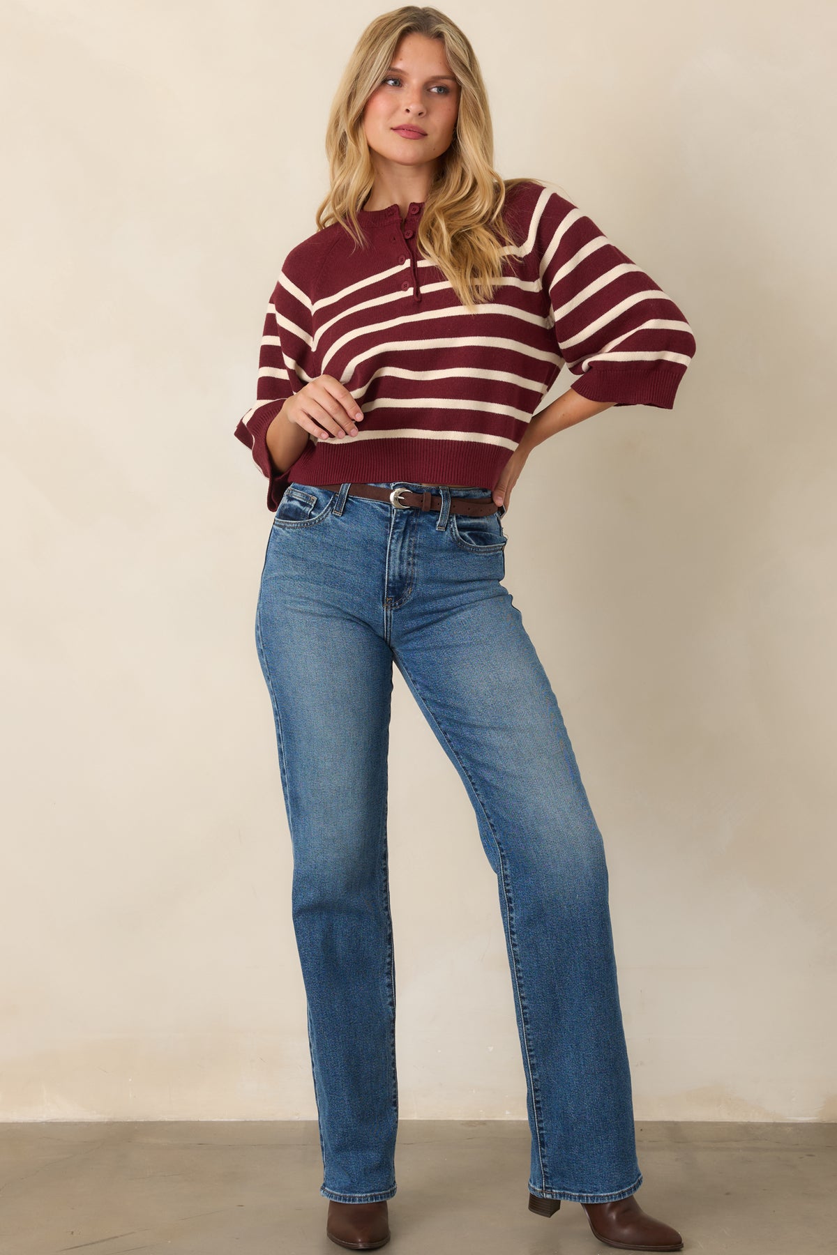 Burgundy and ivory striped knit featuring a henley-inspired button placket and wide sleeves.