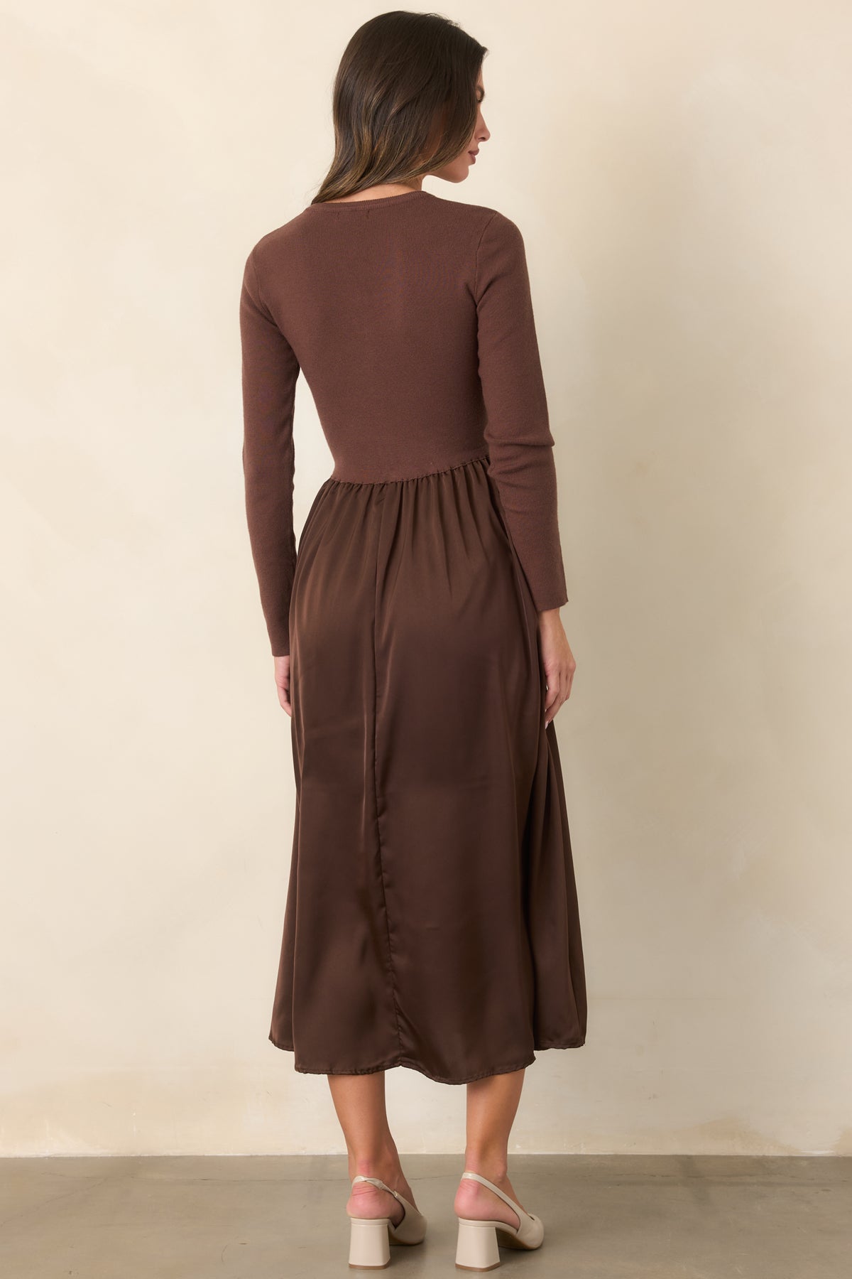 Rear of the burgundy midi dress showing the knit bodice, defined waist, and gently flared satin skirt.