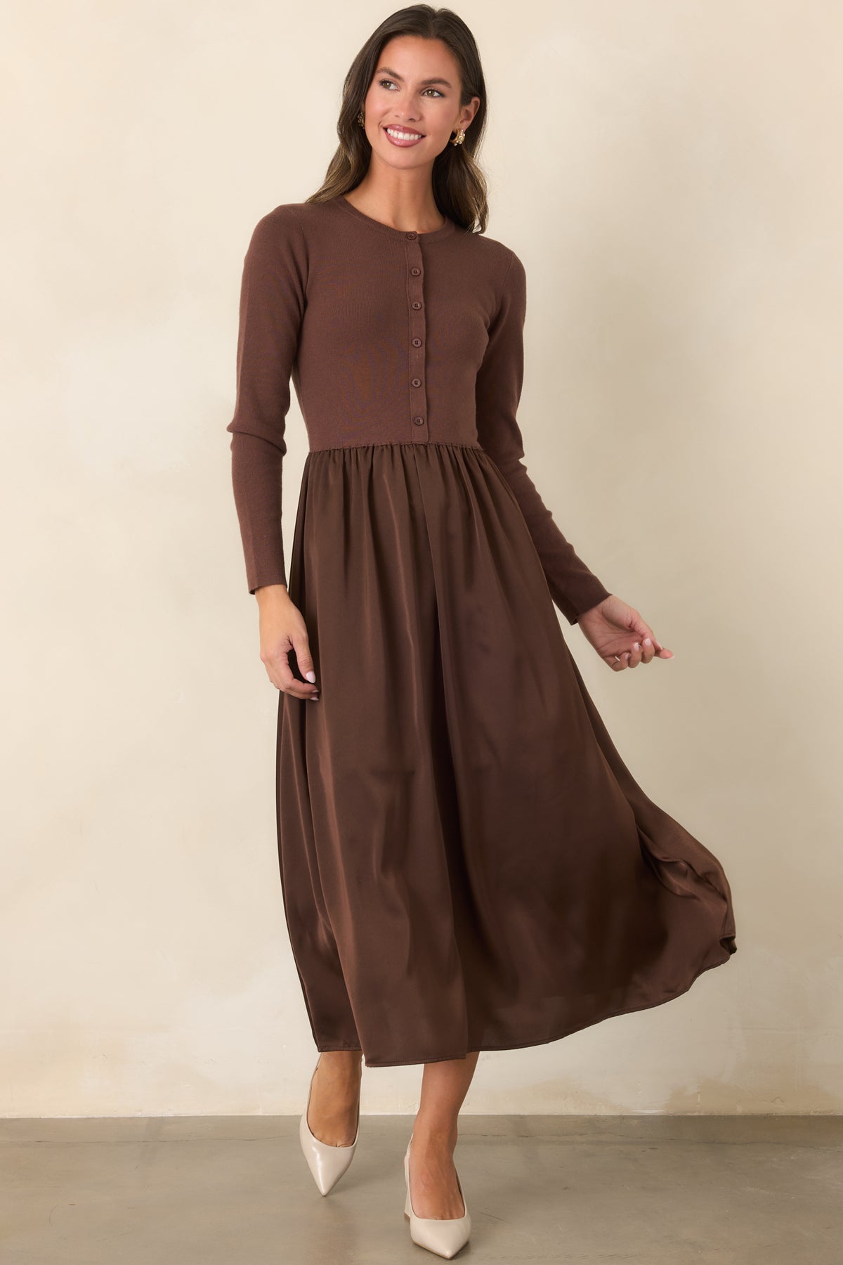 Knit and satin burgundy midi dress with a defined waist and softly flowing skirt.