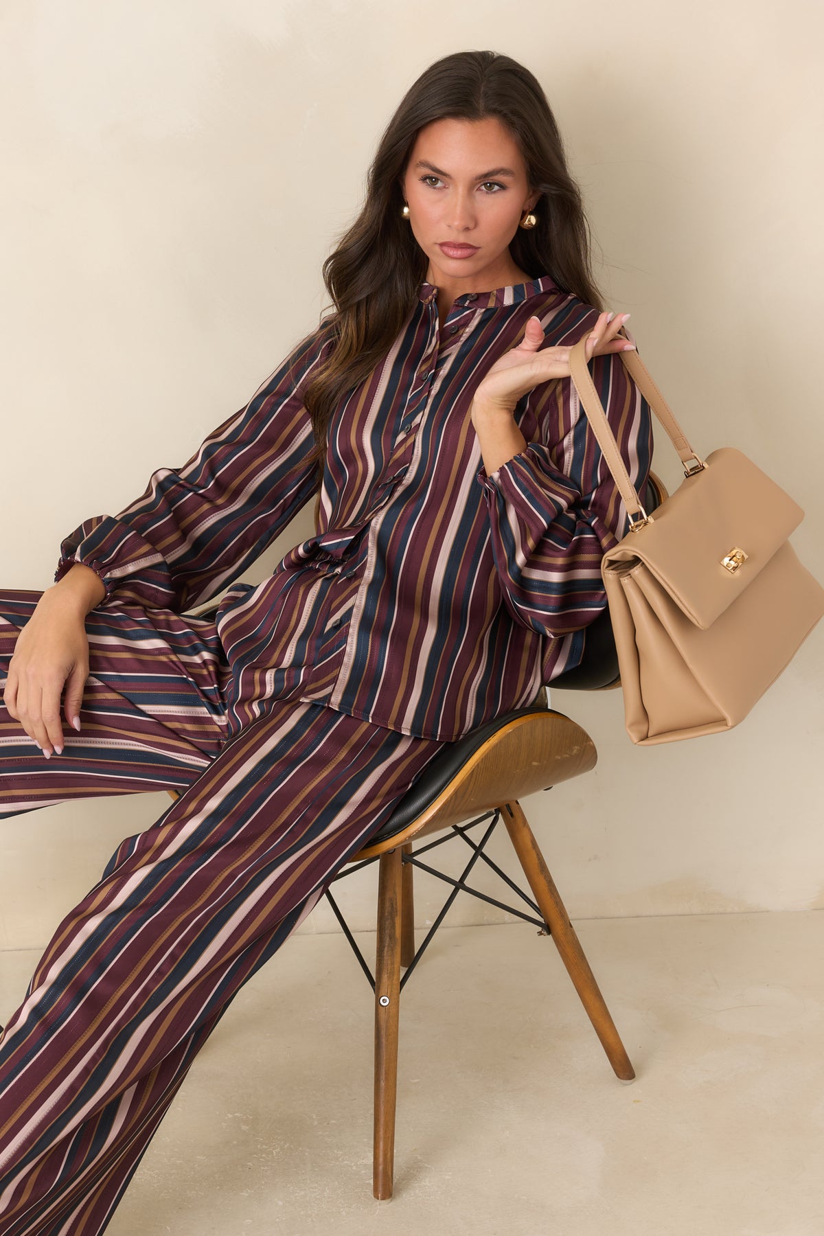  Burgundy, navy, champagne, and olive satin stripes create a vintage-inspired blouse.