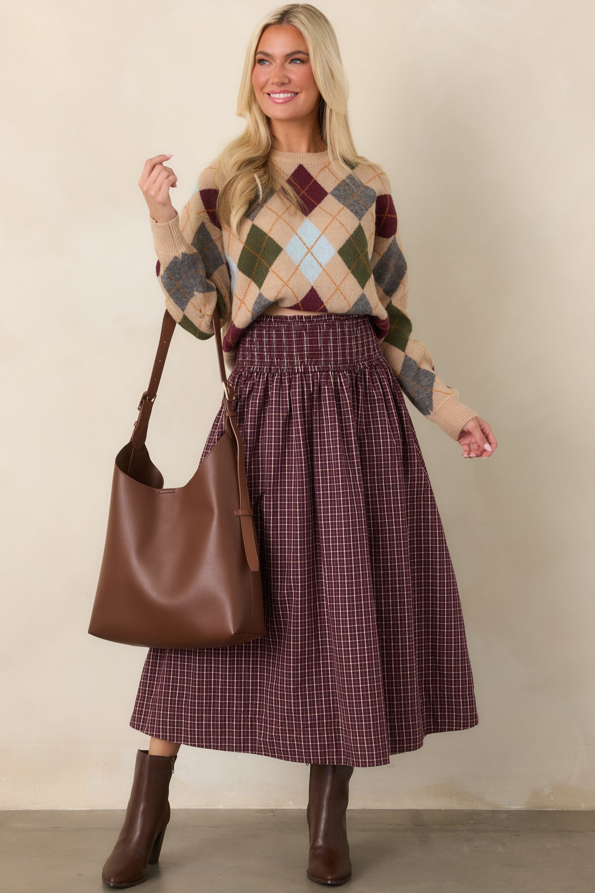 Full-length plaid skirt in burgundy, ivory, and light blue with a comfortable drop waist, voluminous gathered skirt, and functional pockets.