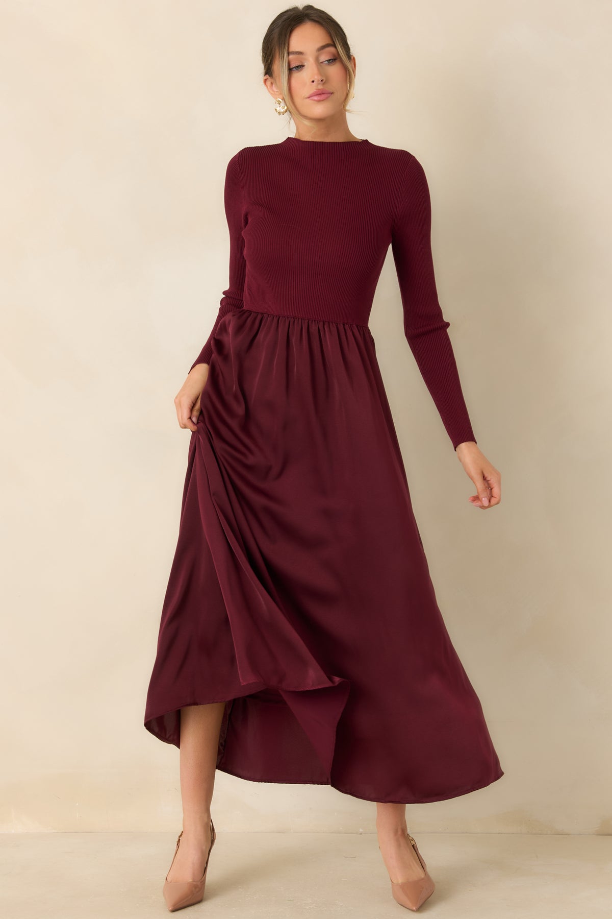 Burgundy pull-on dress with a subtle mock neckline, textured knit upper, and elegant fit-and-flare shape.