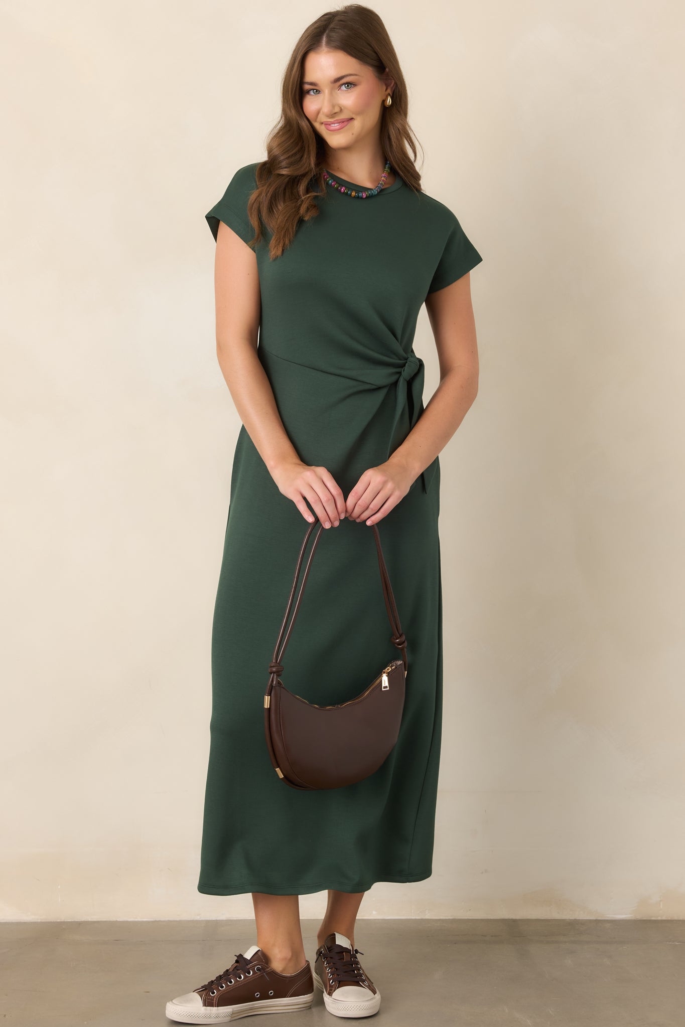 Buttery-soft rayon-blend dress with a graceful midi length, flexible construction, smooth finish, and softly gathered waist knot.