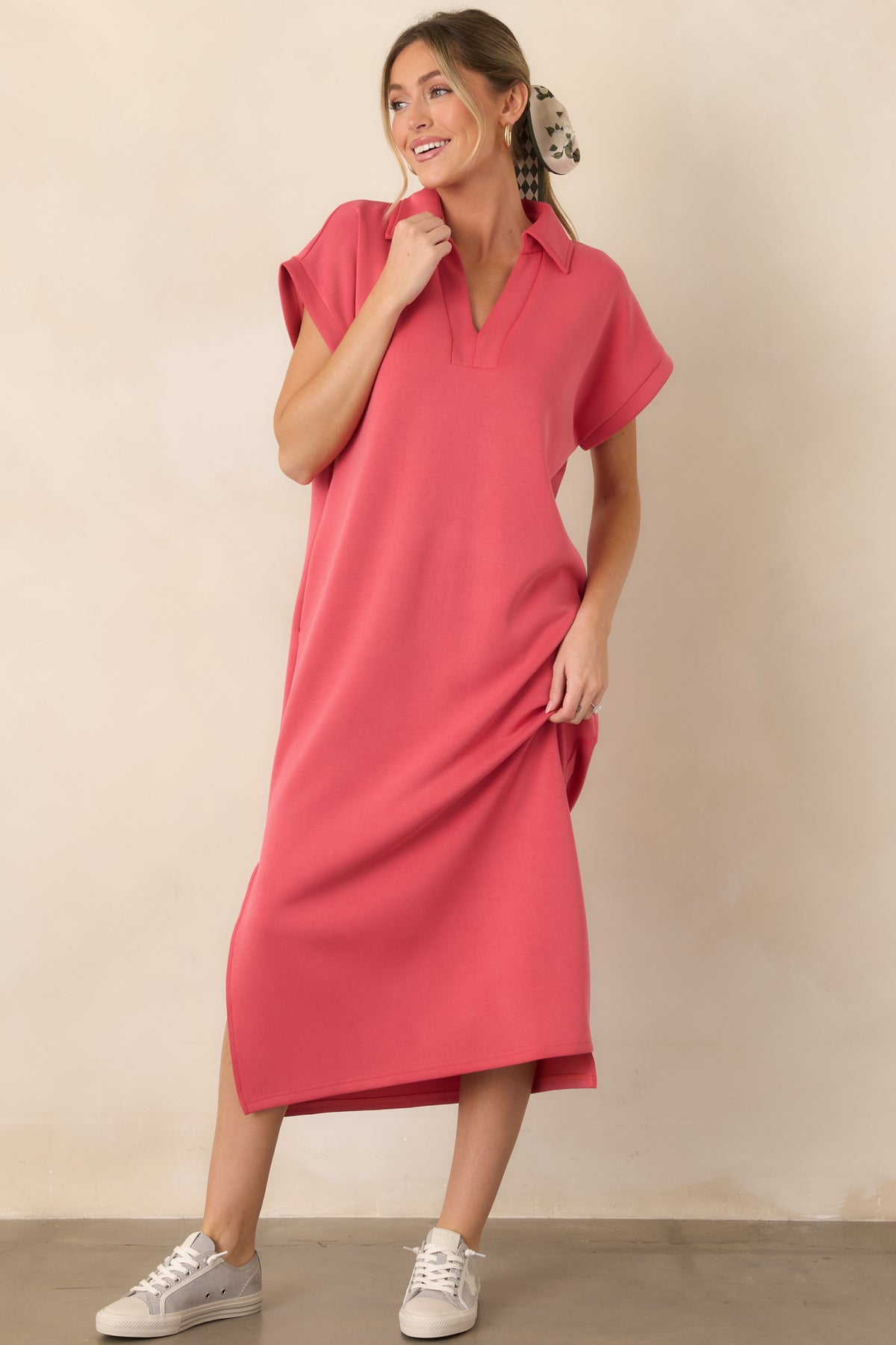 Buttery soft coral pink midi dress with a loose-fitting shape, collared notch neckline, short sleeves, and vented sides.