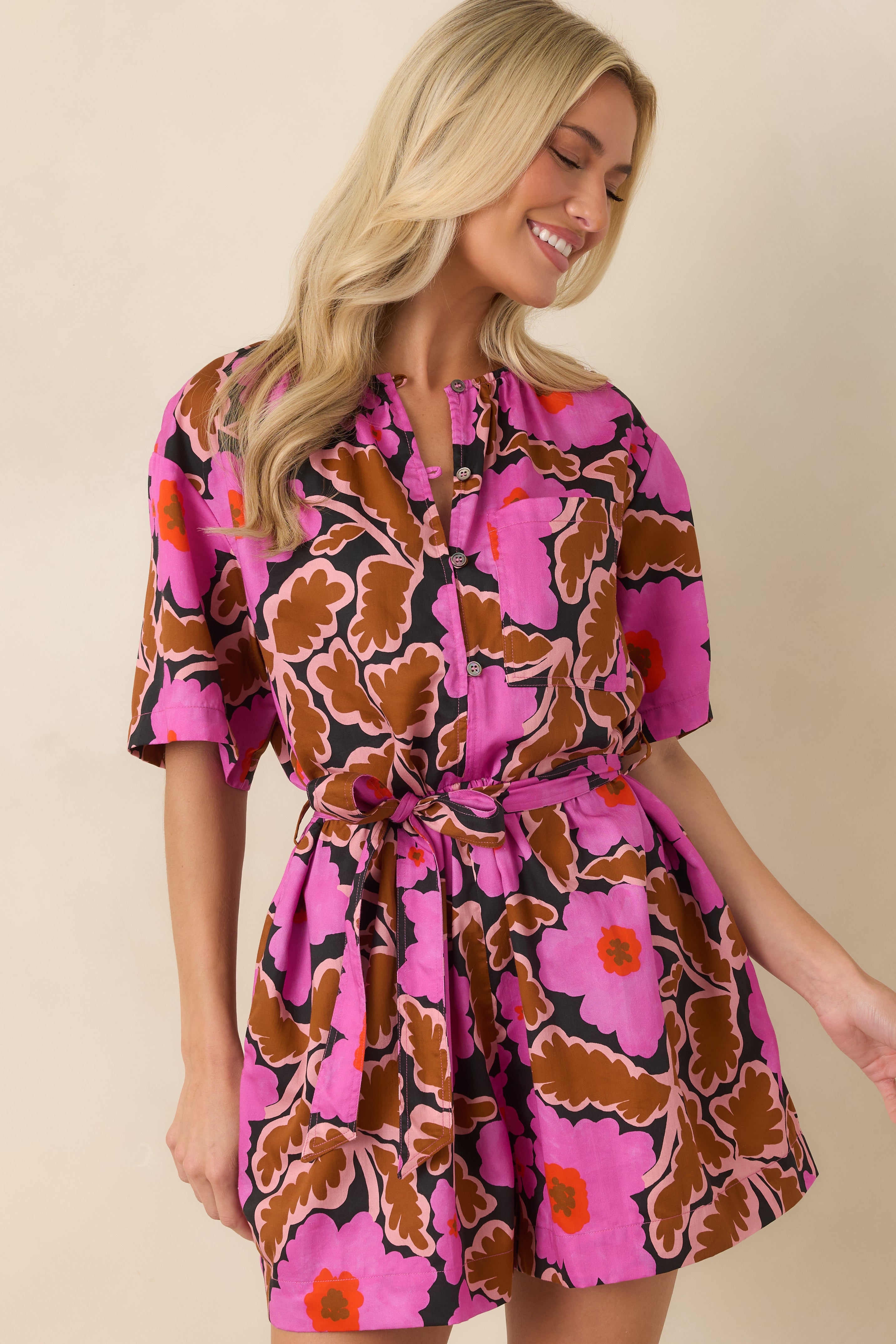 Partial button-front neckline adds a casual finish to the lightweight floral printed romper.