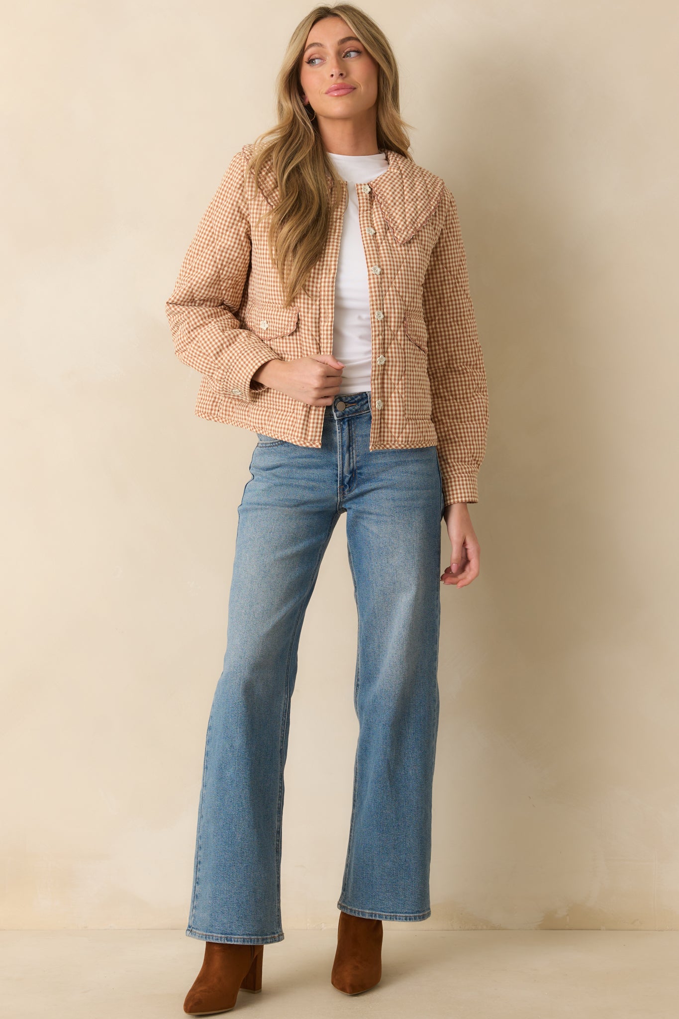 Button-front jacket in light rust featuring long sleeves with button cuffs and functional front flap pockets.