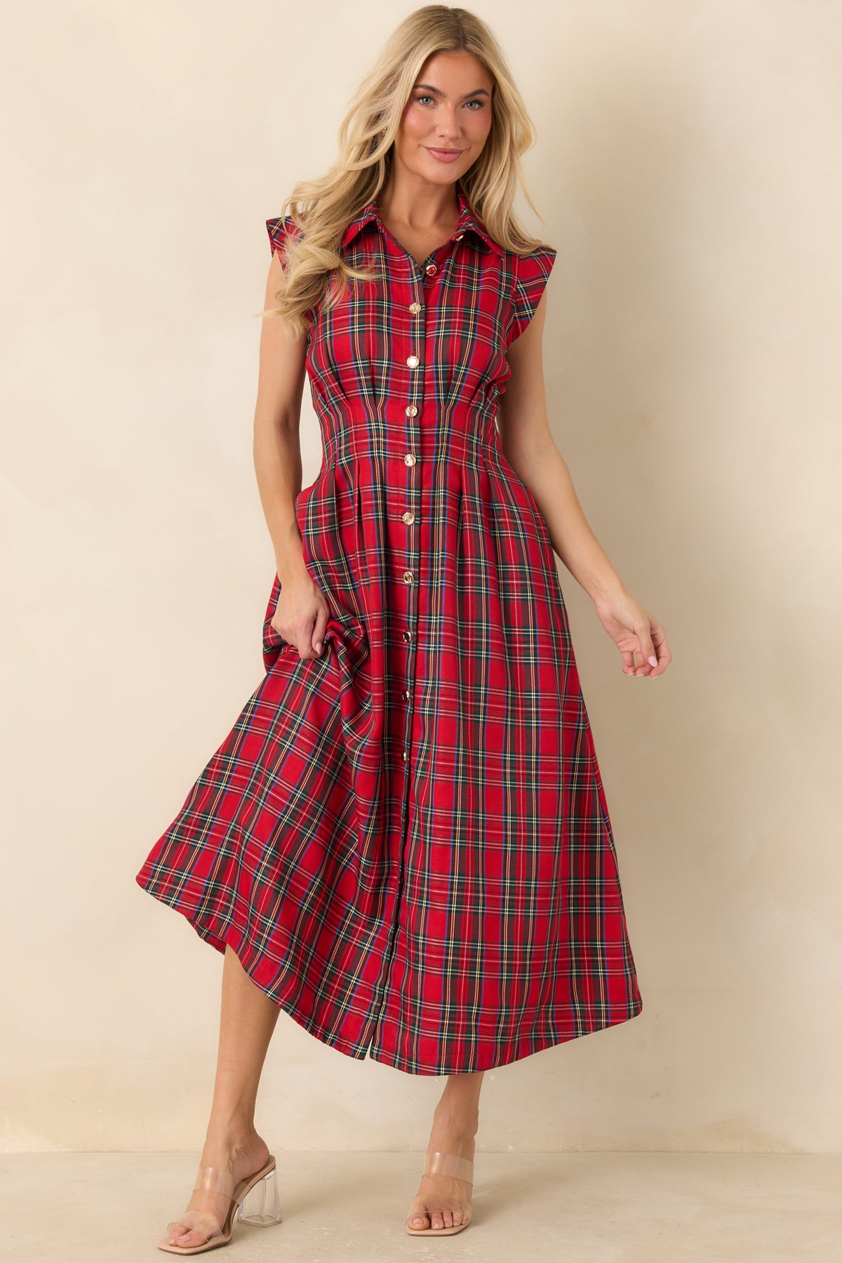 Button-front midi dress with a classic pointed collar, structured shoulders, and a flattering A-line silhouette.
