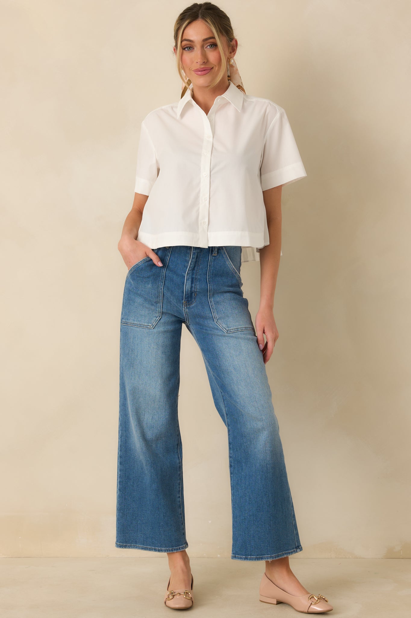 Button-up top with pointed collar, straight hemline, and airy woven fabric for easy wear.