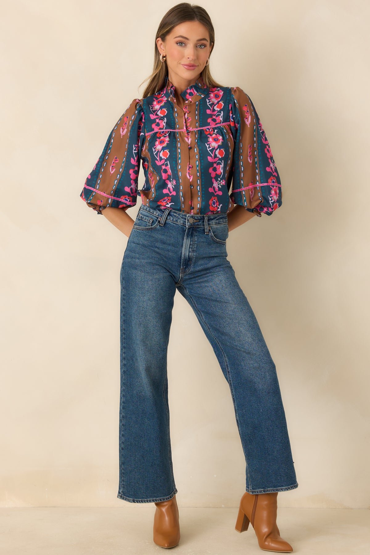 Deep teal and caramel striped blouse with ivory and coral florals, pink yoke trim, and a ruffled neckline.