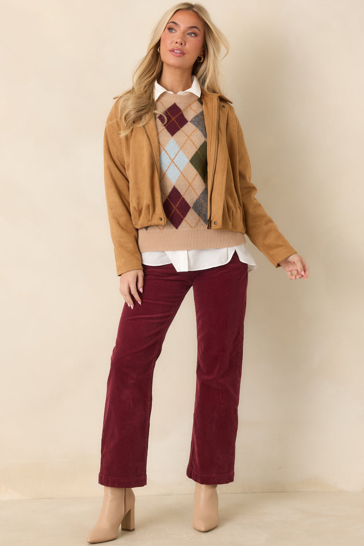 Camel argyle knit sweater with burgundy, olive, grey, light blue, and golden diamond accents.