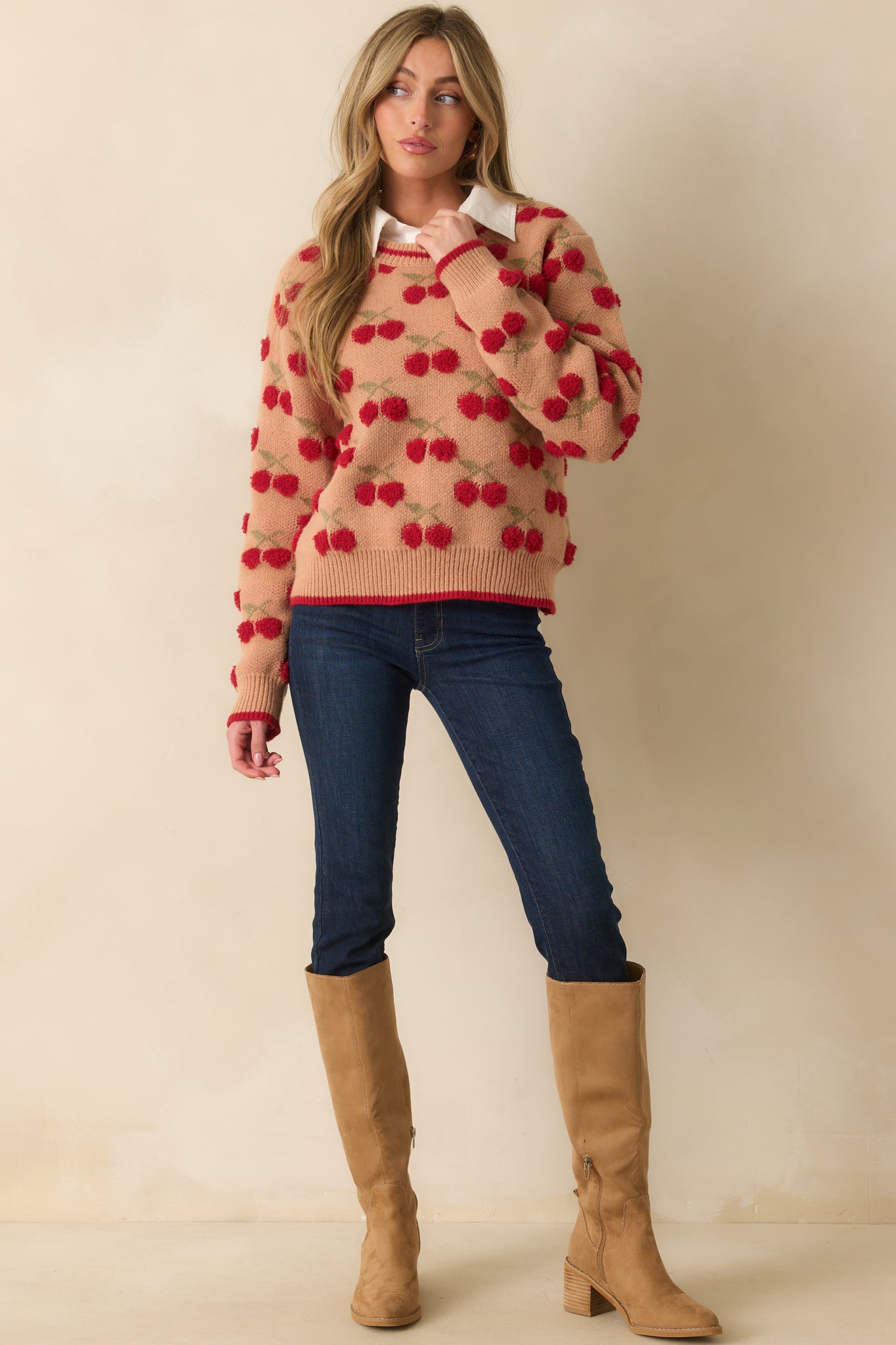 Crew-neck camel brown sweater with ribbed detailing and all-over red chenille cherries.