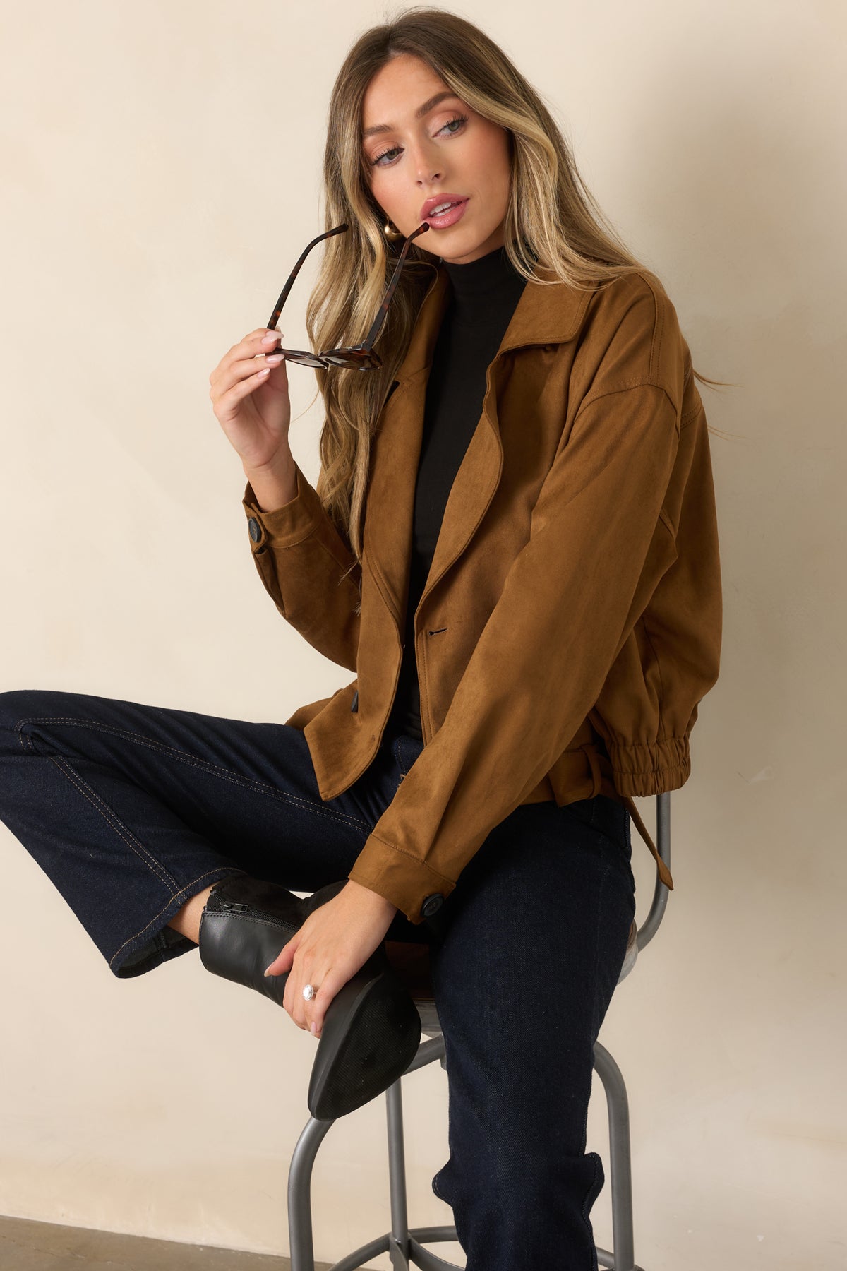Camel faux suede cropped trench coat with structured button closures and front pockets.