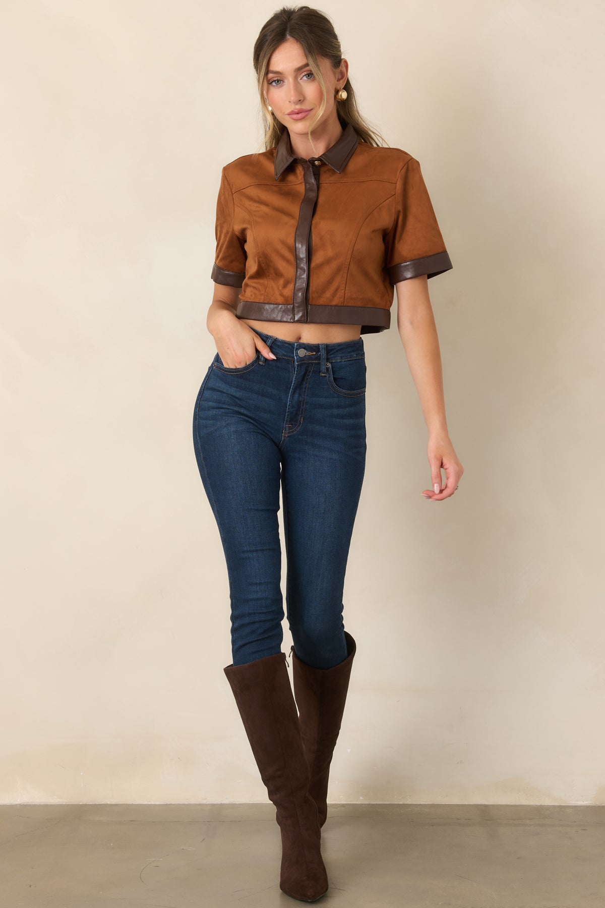 Camel faux suede top featuring a pointed collar, short sleeves, and contrasting brown faux leather details.
