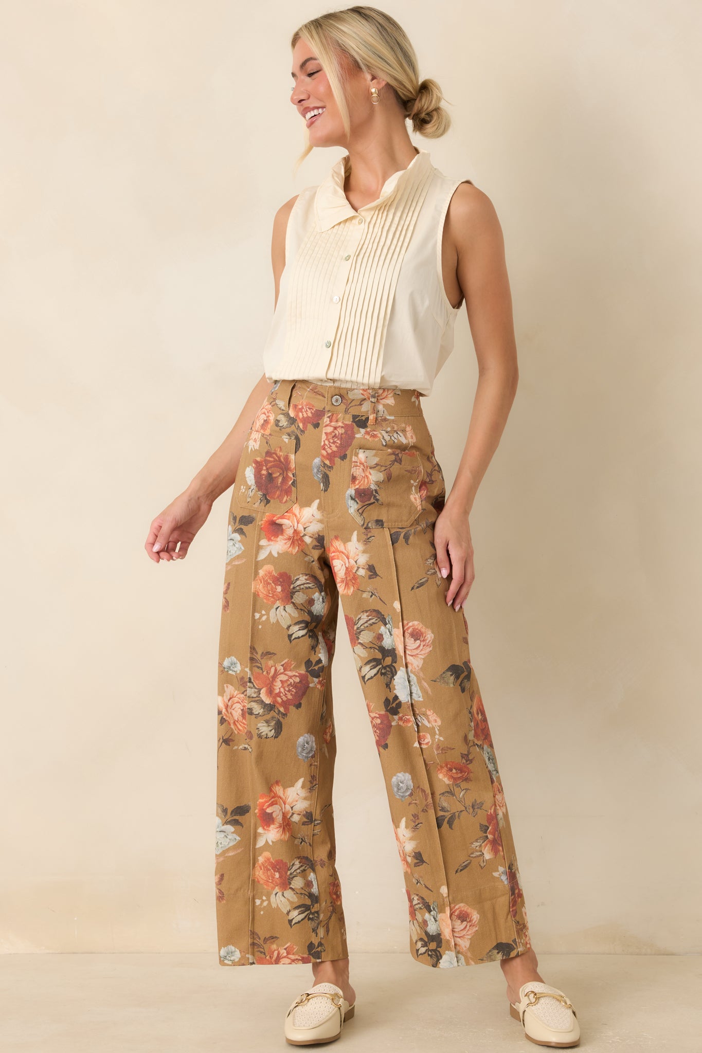 Camel floral cotton pants featuring a high-rise waist, relaxed wide leg silhouette, pressed front seams, and patch pockets.