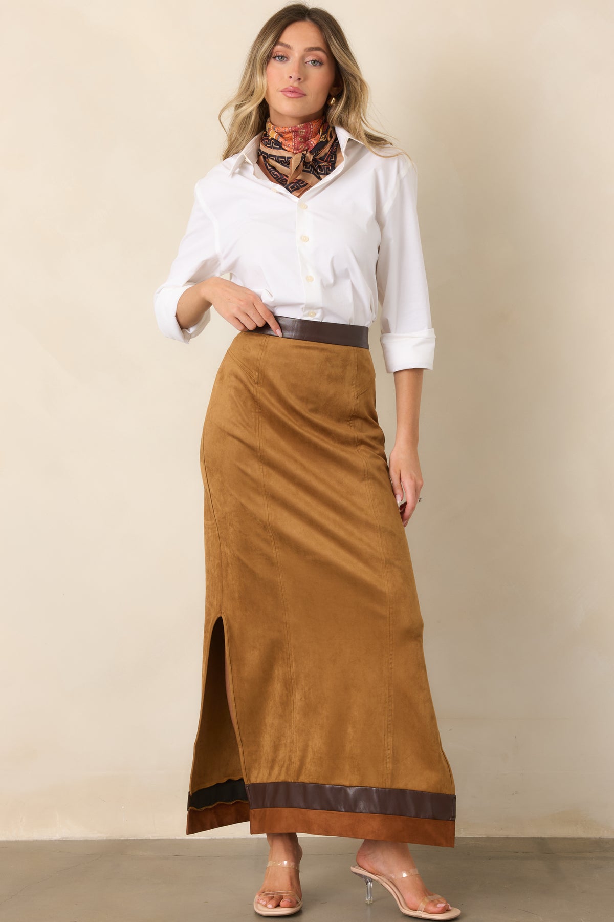 Warm camel maxi skirt showcasing its straight silhouette and contrasting chocolate brown waistband detailing.