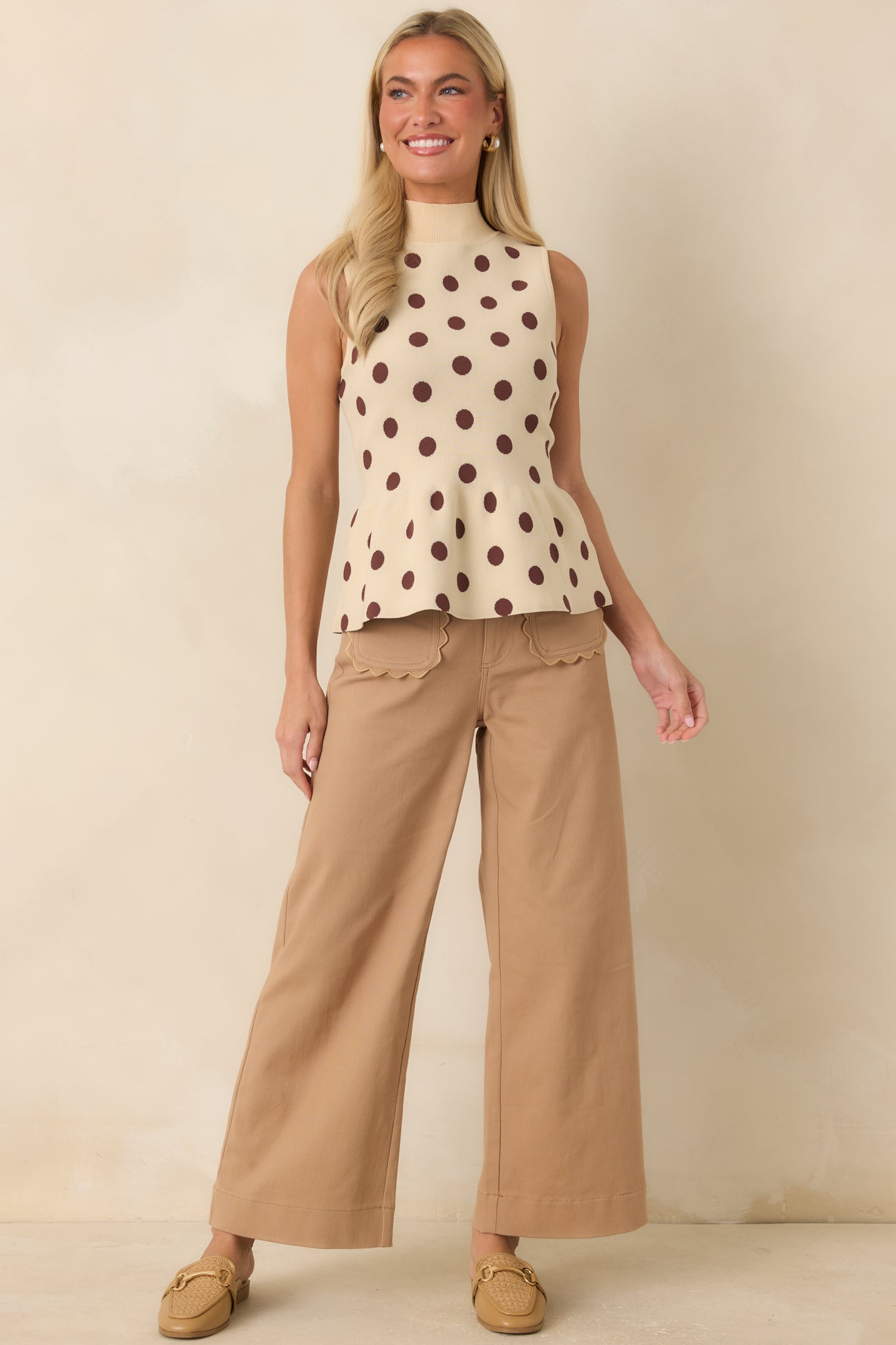 Camel tailored pants featuring a high-rise waist, wide-leg silhouette, scalloped front patch pockets, and polished everyday style.