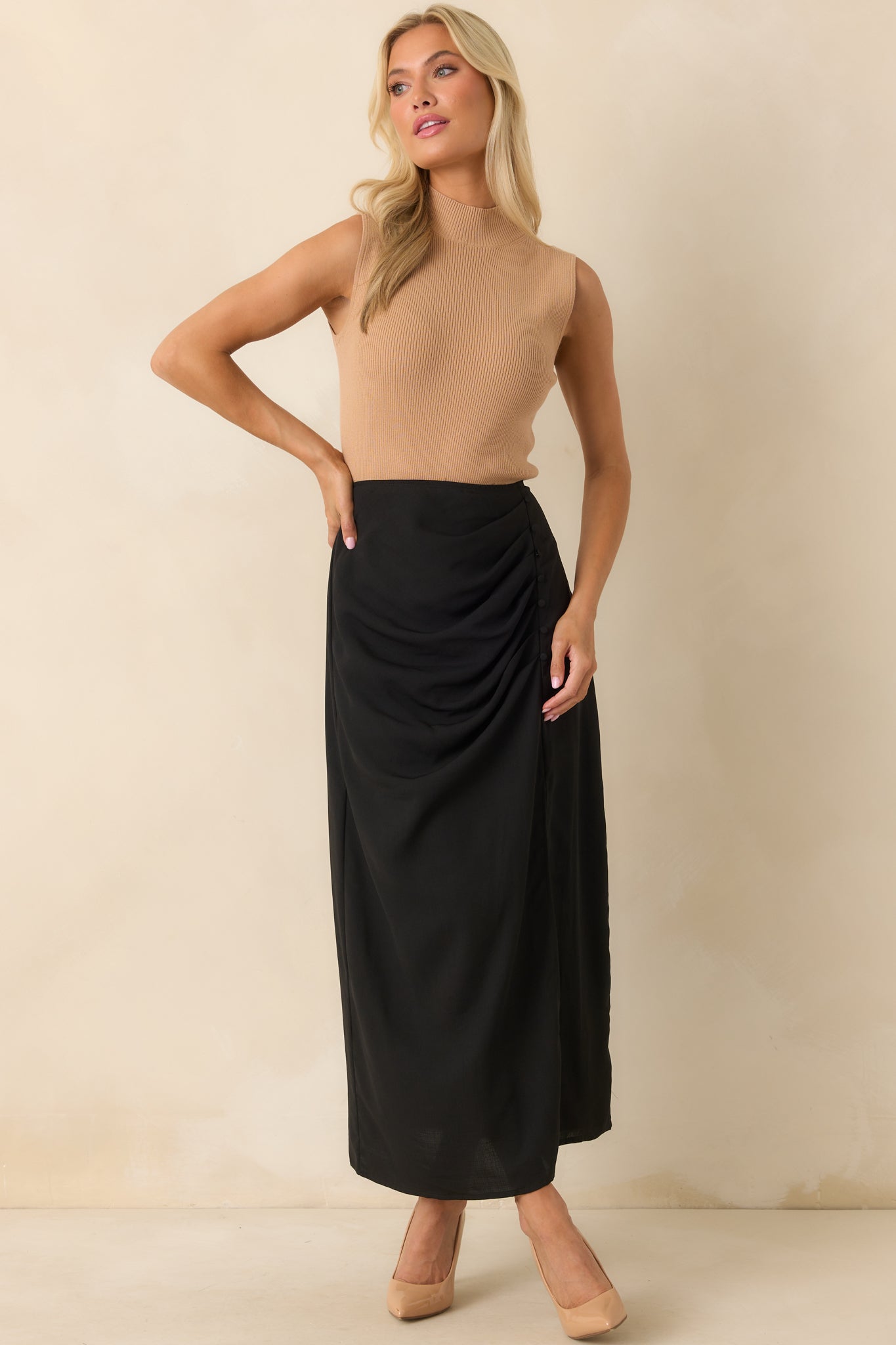 A full body view of the camel top showing the fitted silhouette and sleeveless design.