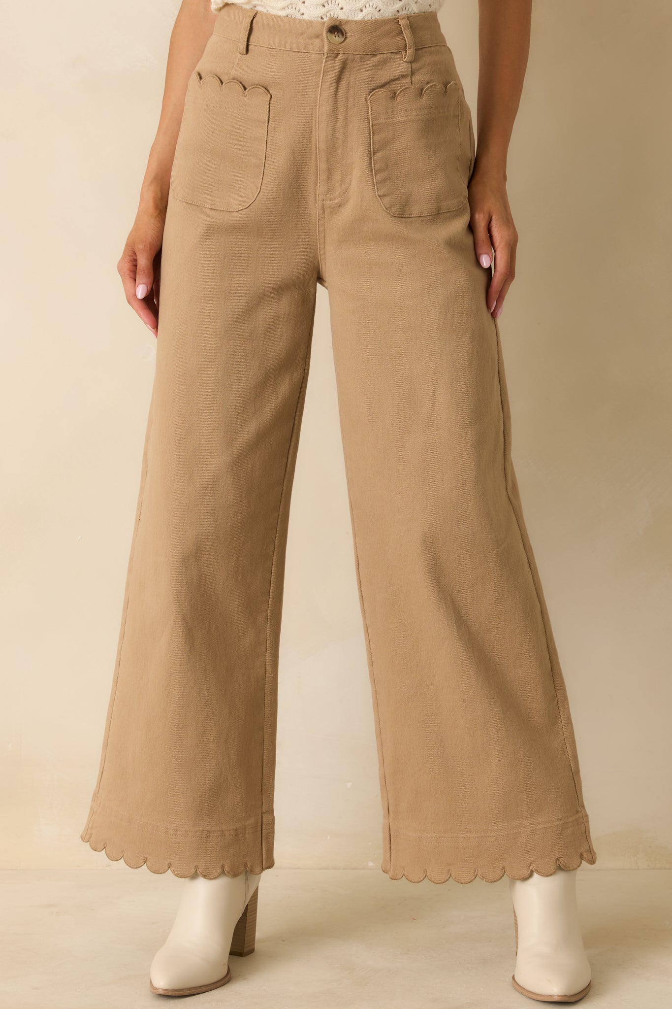 Camel wide-leg pants showing high-waisted fit and structured cotton fabric