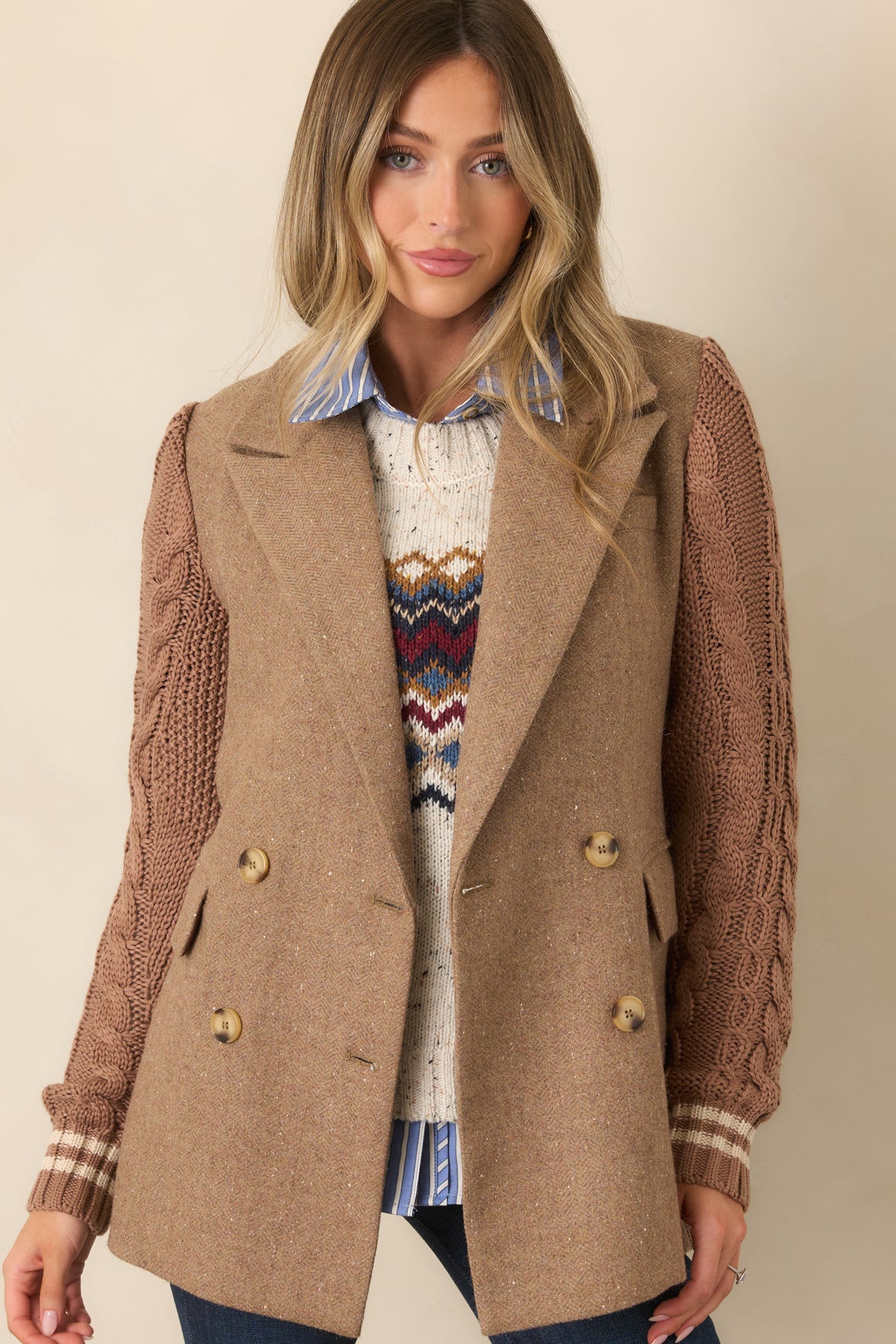 Camel wool-blend blazer highlighting the contrast between its smooth body and textured knit sleeves.