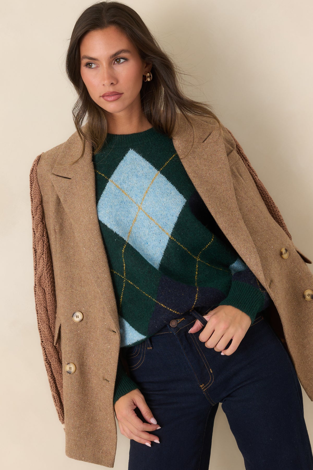 Close view of the camel wool-blend fabric, notched lapels, and structured double-breasted front.
