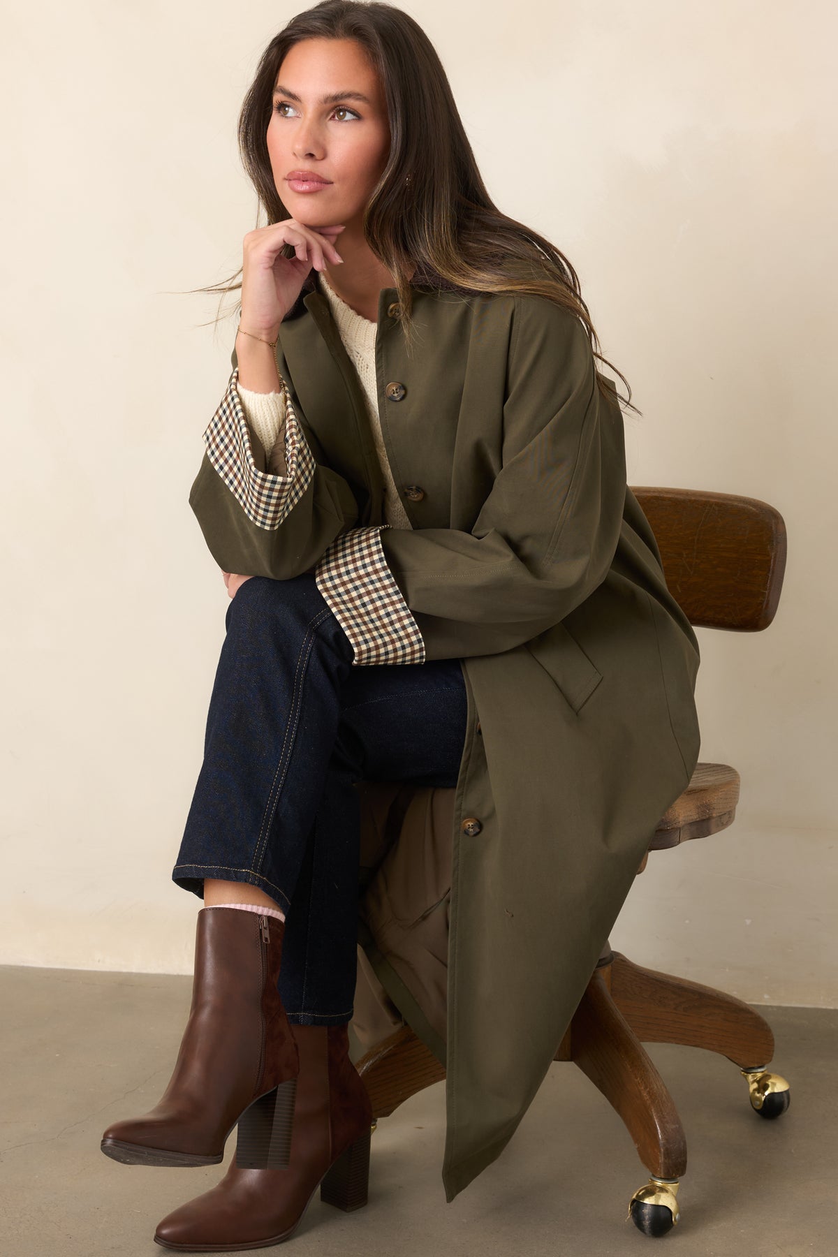 Smooth canvas-feel coat with a button front, chocolate brown corduroy collar, coordinating tie belt, and side pockets.