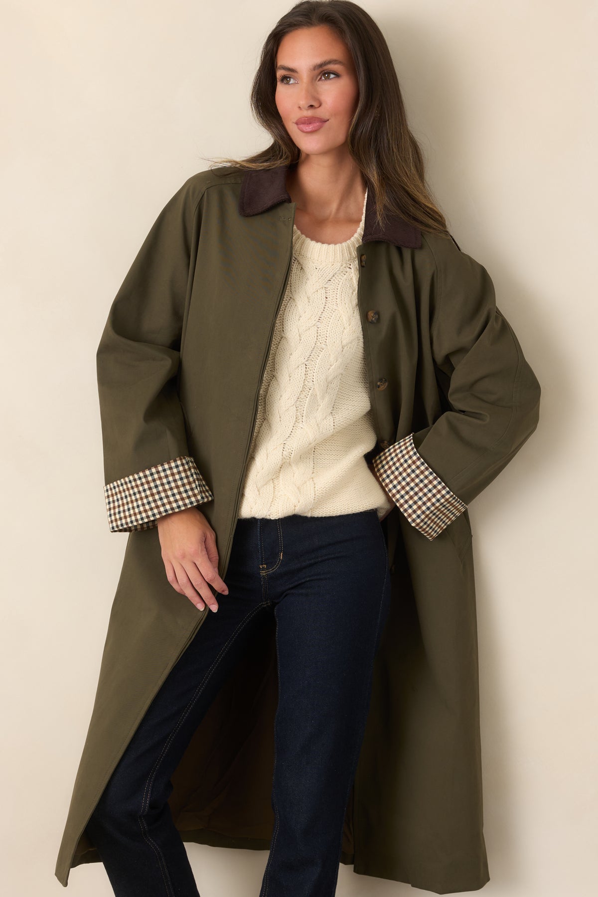 Coordinating tie belt defines the waist of this smooth canvas-feel coat with checked cuffs.