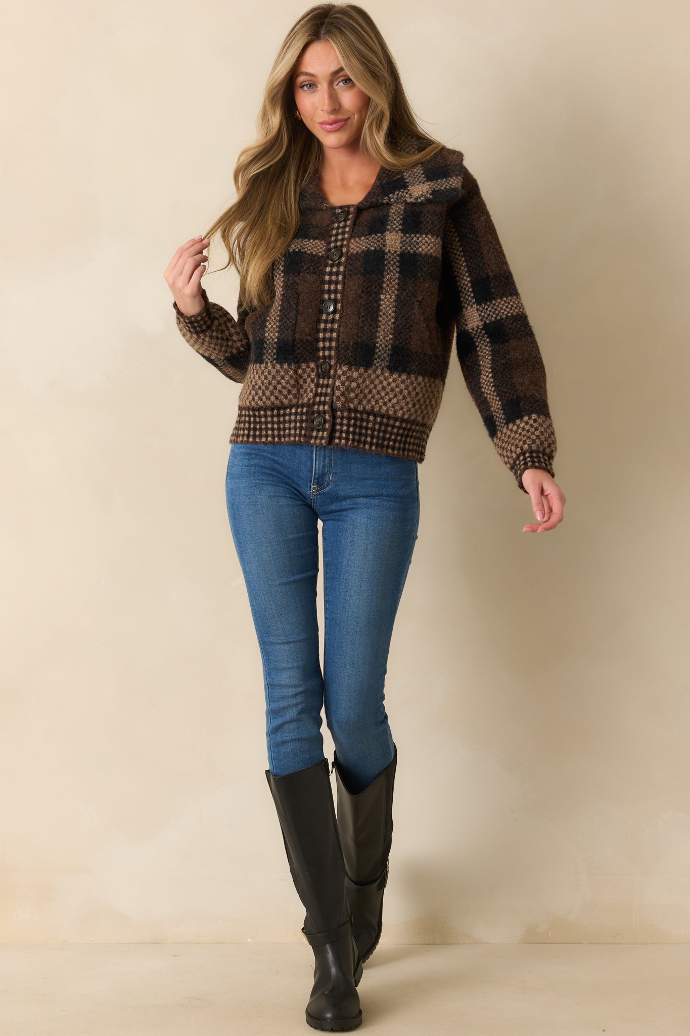 Front view of cardigan featuring long sleeves, functional patch pockets, and relaxed fit.
