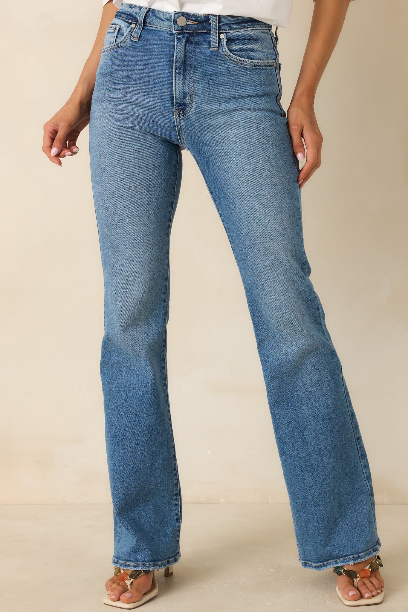 Close view of casual flare jeans featuring soft denim texture and a versatile lived-in finish.