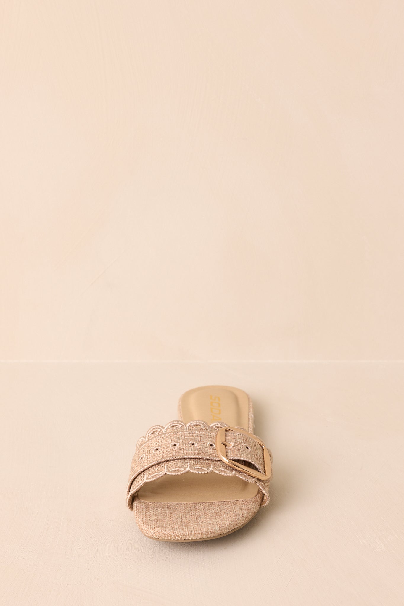 Casual flat sandals with scalloped hem, slip-on style, and subtle gold hardware.