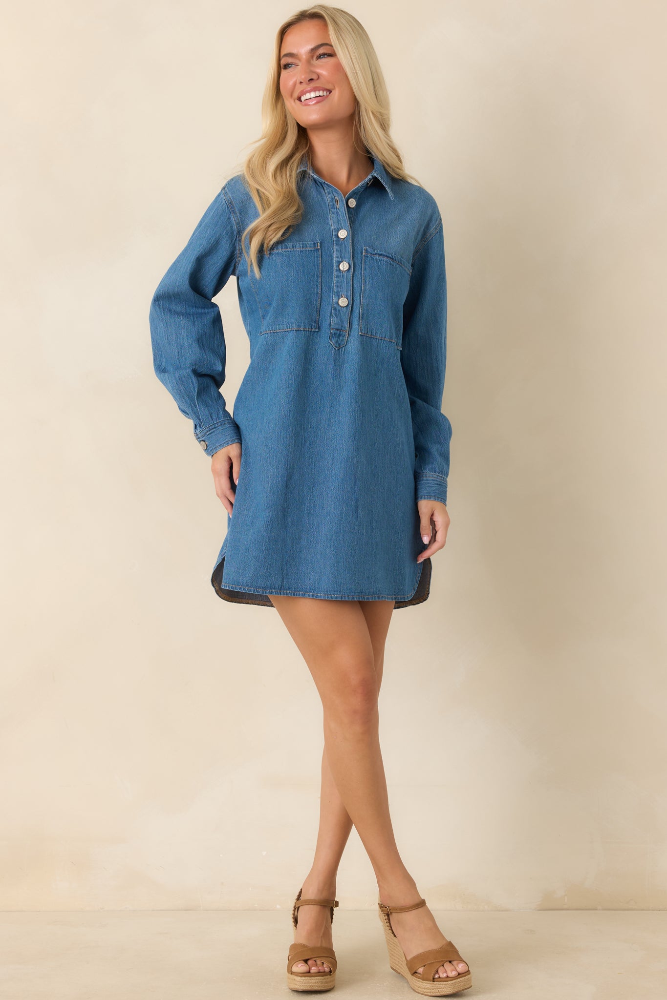 Casual mini dress featuring a structured collar, button cuffs, and an effortless relaxed fit.