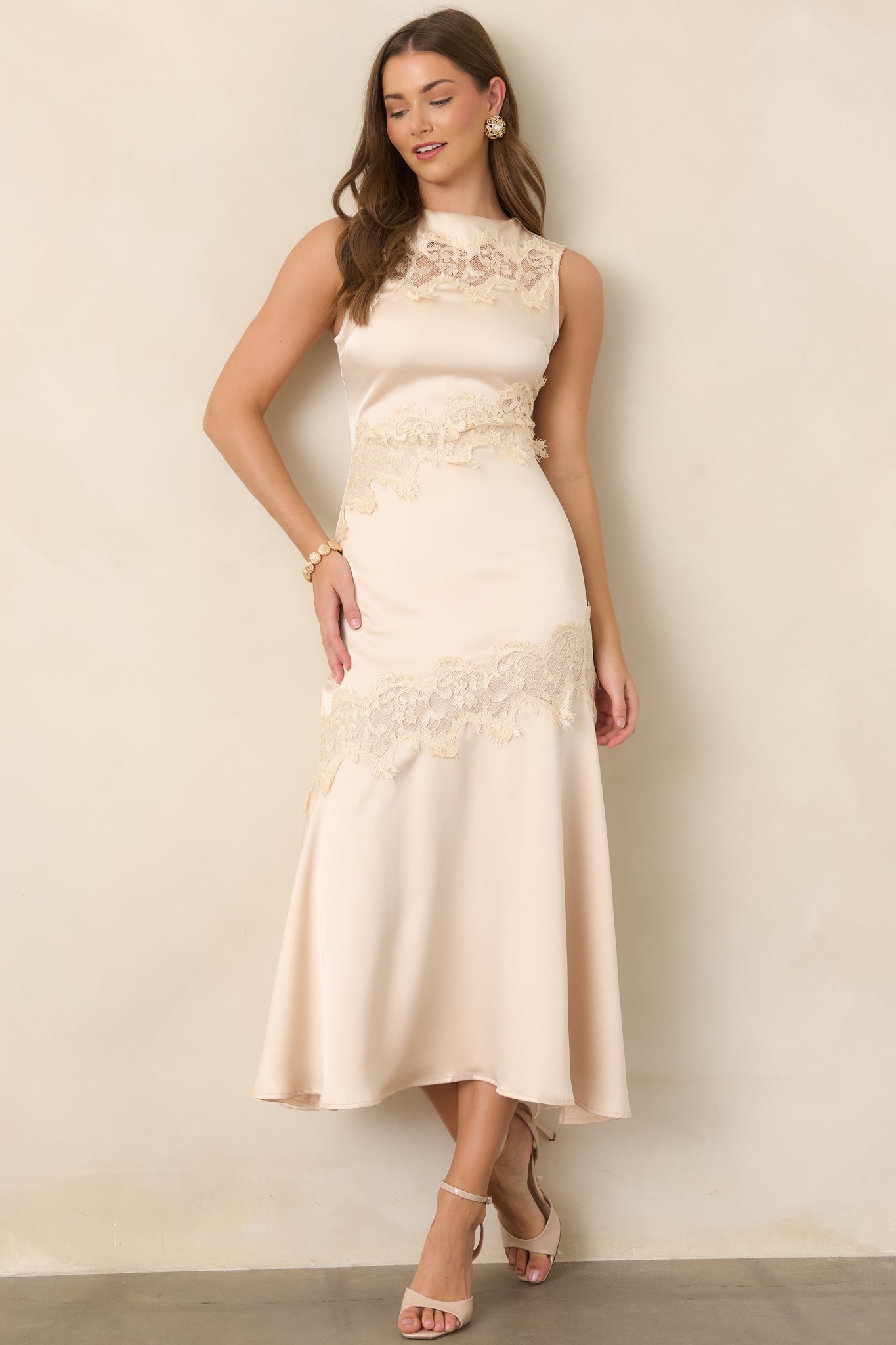 Champagne satin midi dress with a fitted sleeveless silhouette, tonal lace detailing, and softly flared hem.