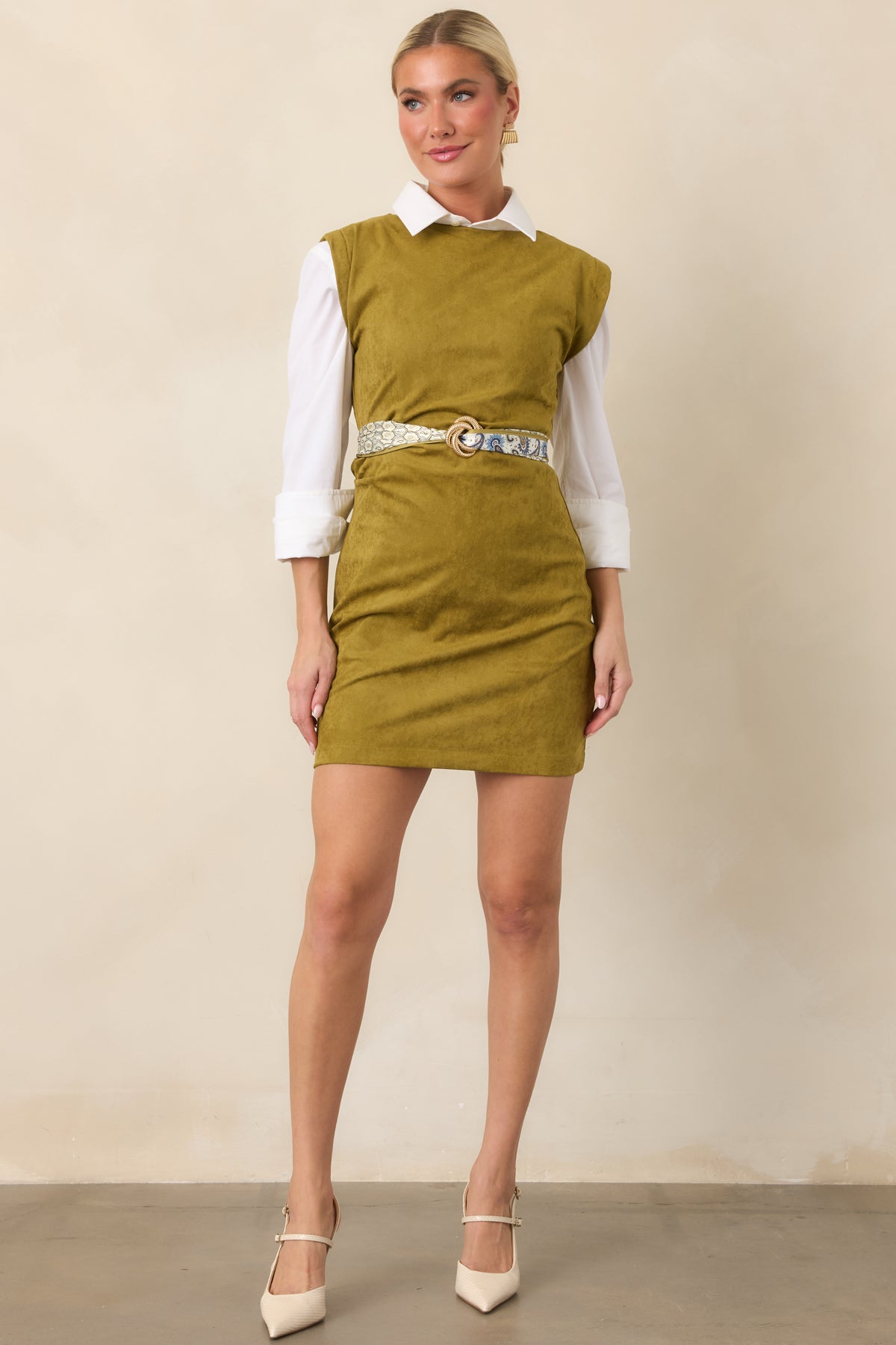 Fitted chartreuse mini dress featuring waist ruching that creates dimension and a softly draped silhouette.
