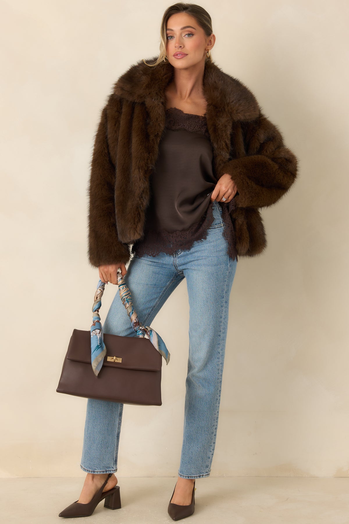 Soft faux fur jacket in rich chocolate brown with a statement collar and structured front closures.