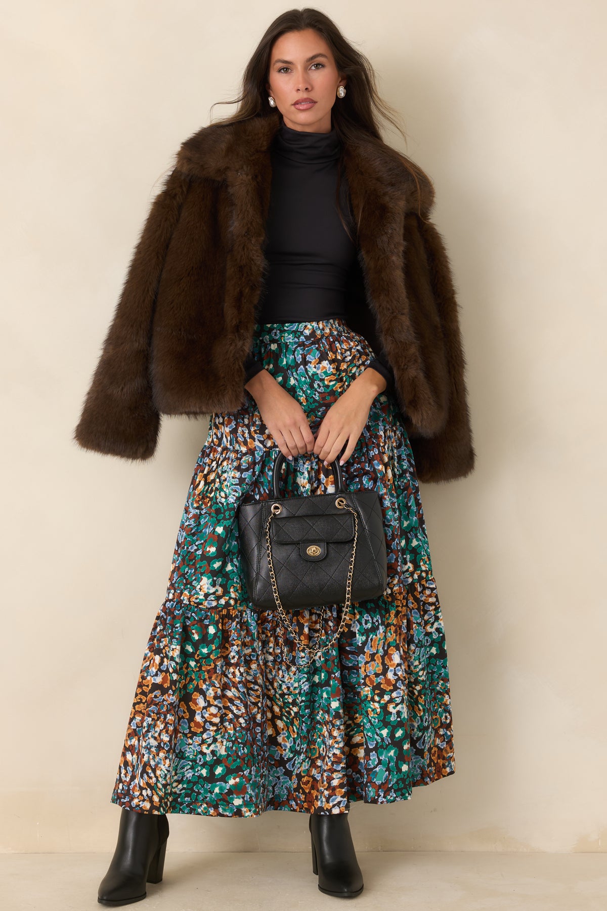 Chocolate brown faux fur jacket showcasing its oversized collar and easy layering silhouette.