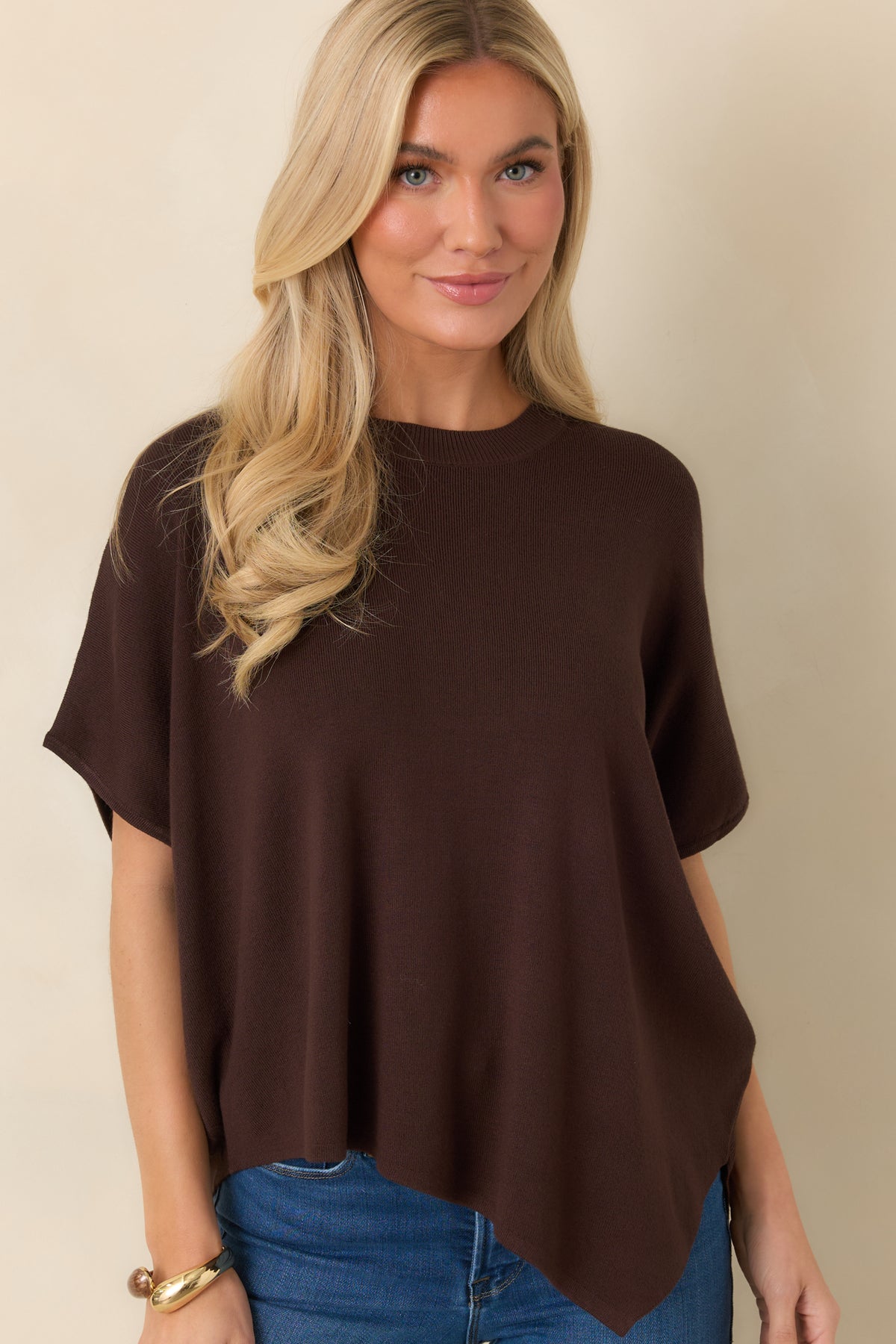 Chocolate brown top highlighting its rounded neckline and soft, lightweight knit texture.
